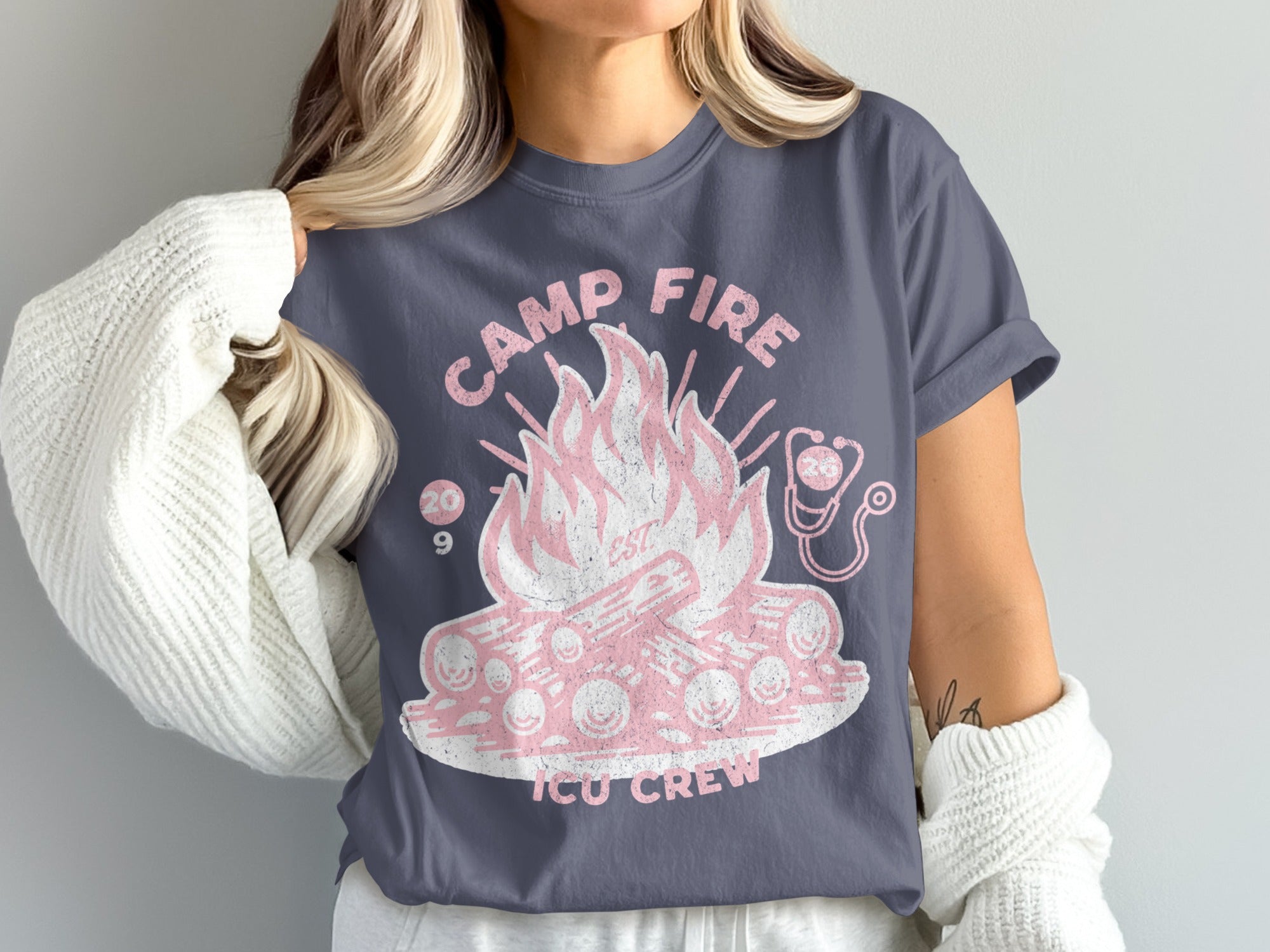 T-shirt with campfire design, text "CAMP FIRE EST 209 ICU CREW," and stethoscope.