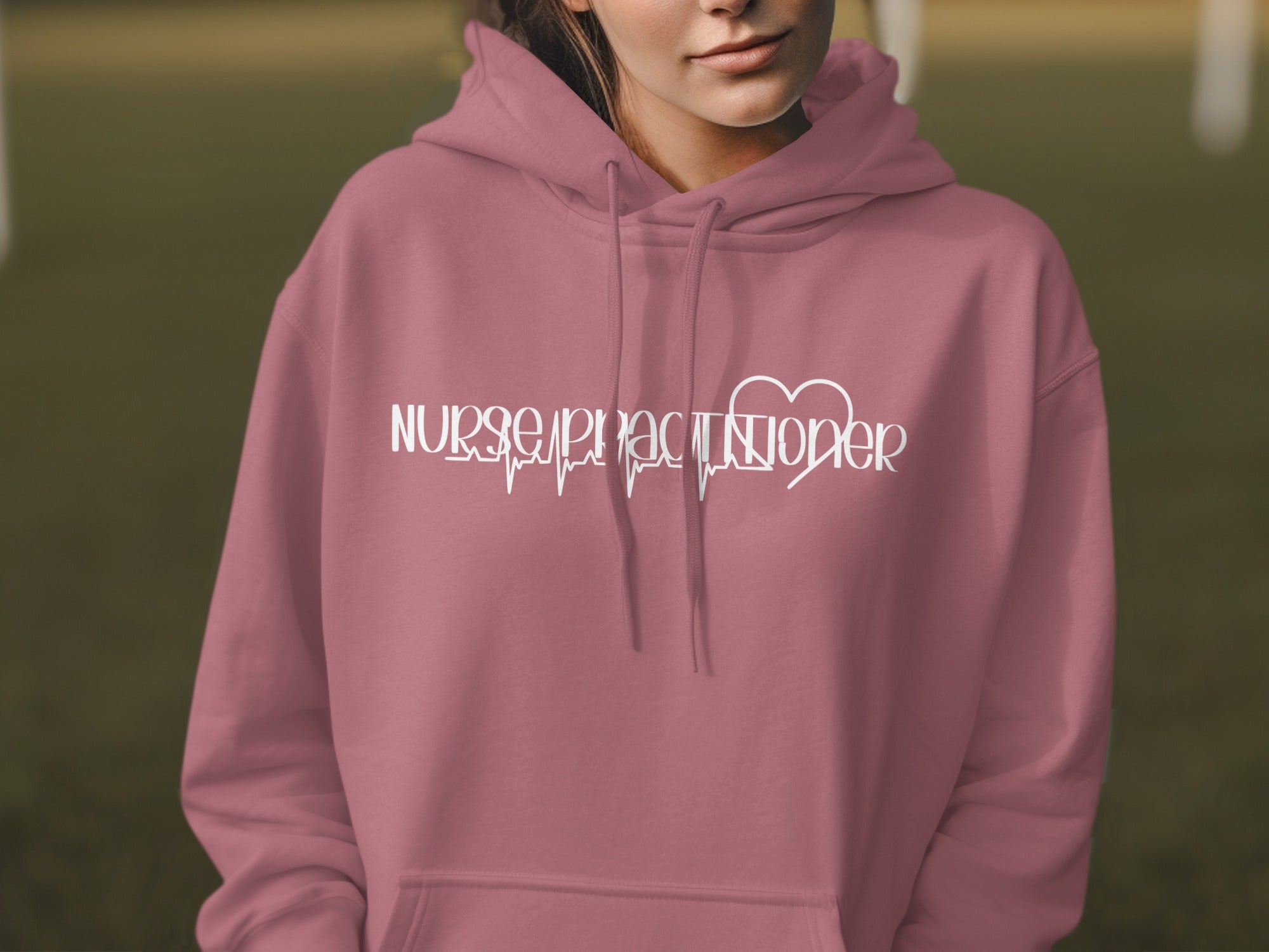Rose hoodie with "Nurse Practitioner" and heart rhythm graphic.