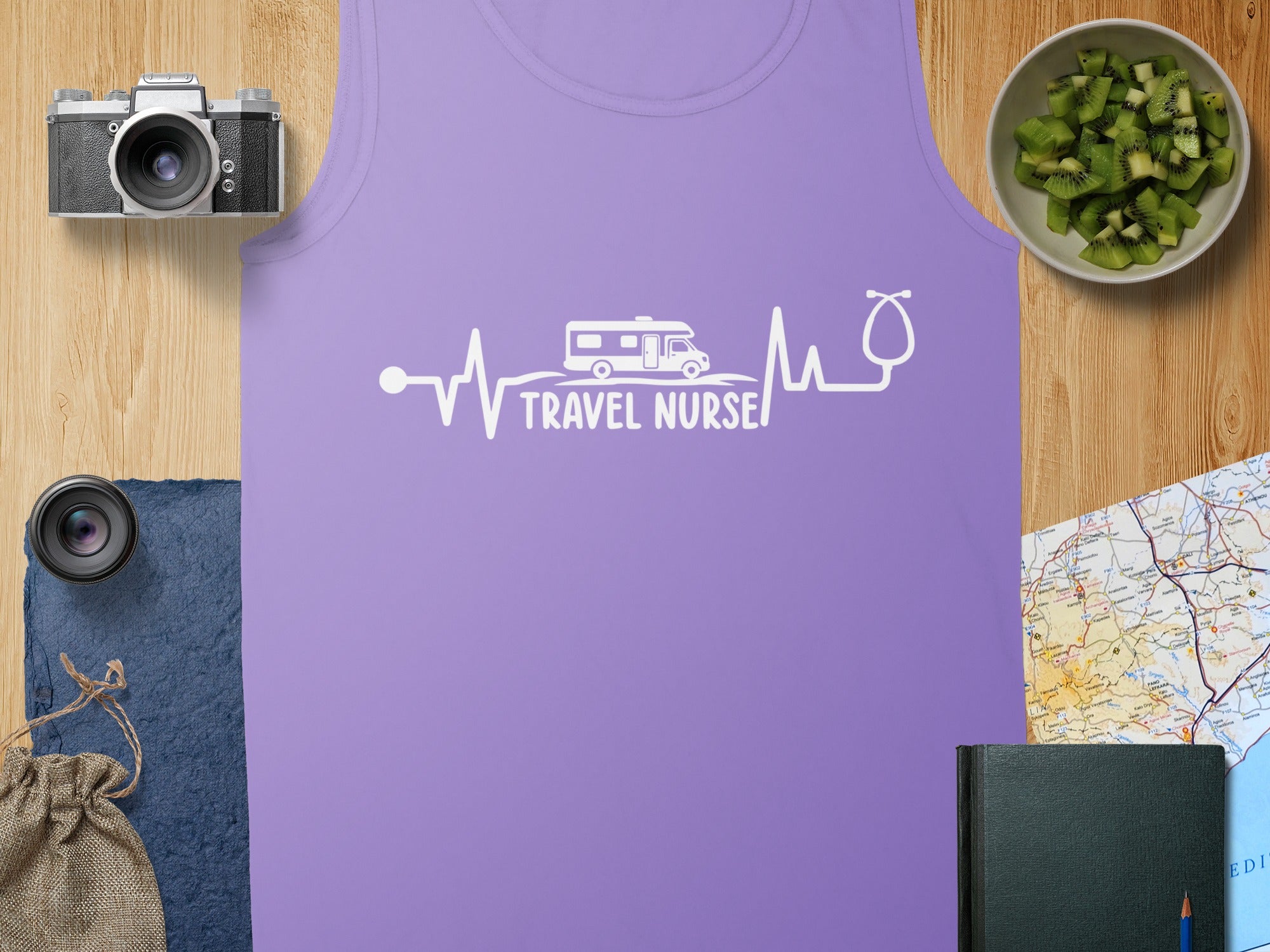 White "Travel Nurse" text with a heartbeat and RV on a purple tank top.