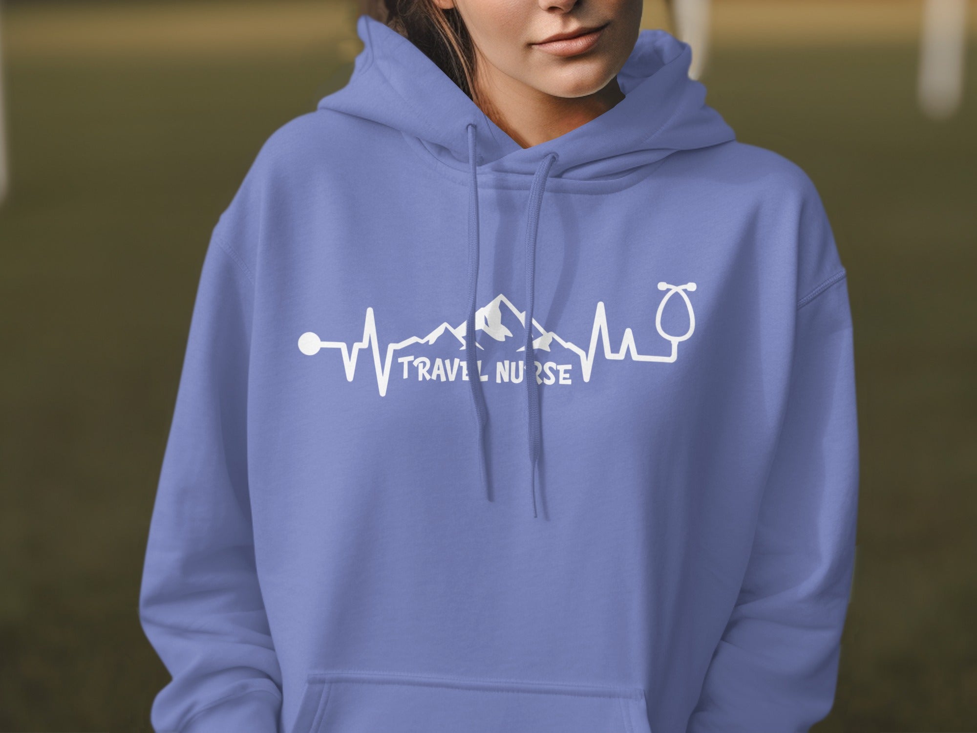 Purple hoodie with "Travel Nurse" inside a mountain and heartbeat graphic.