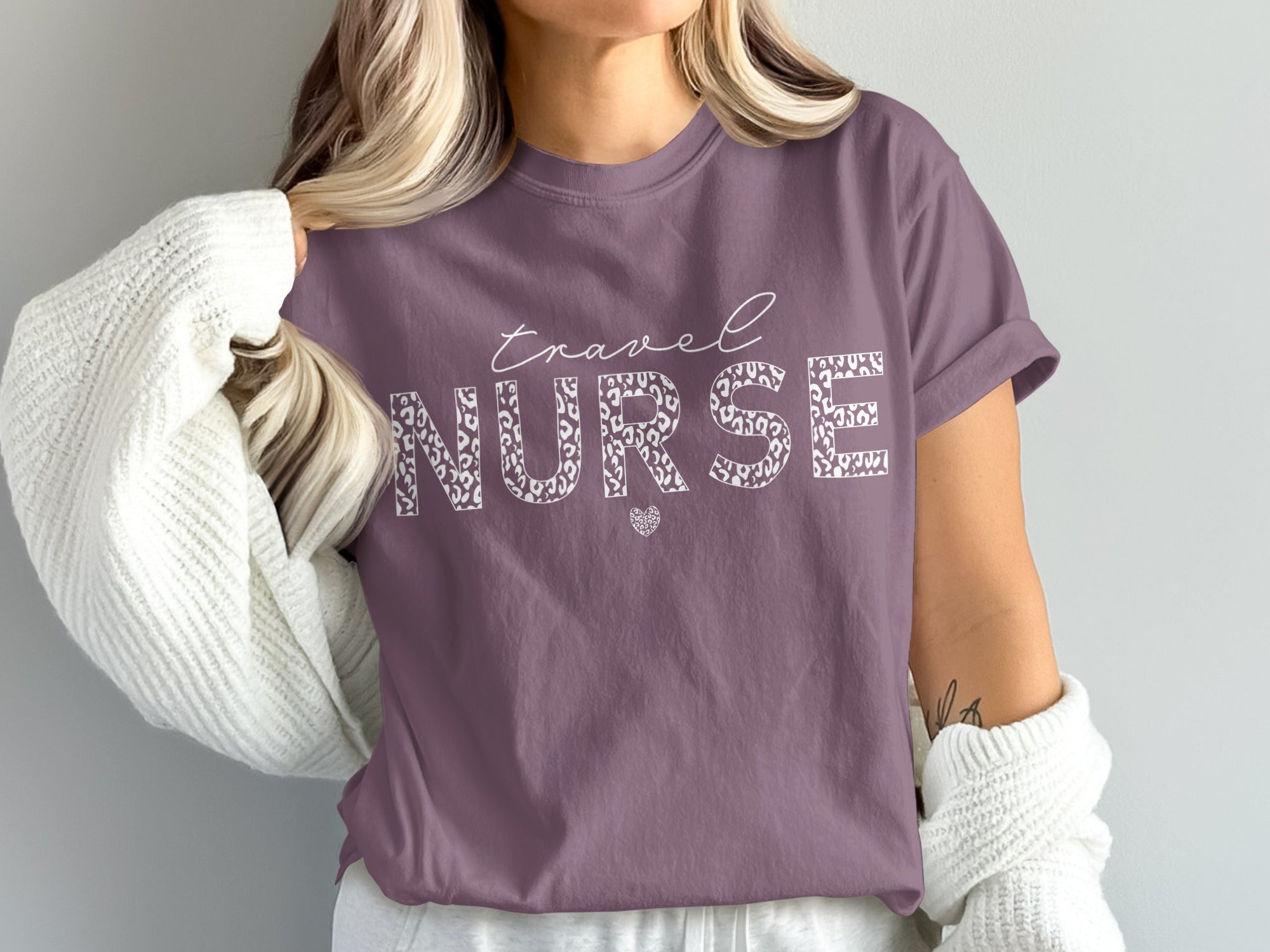 Purple t-shirt with "travel NURSE" text in leopard print.