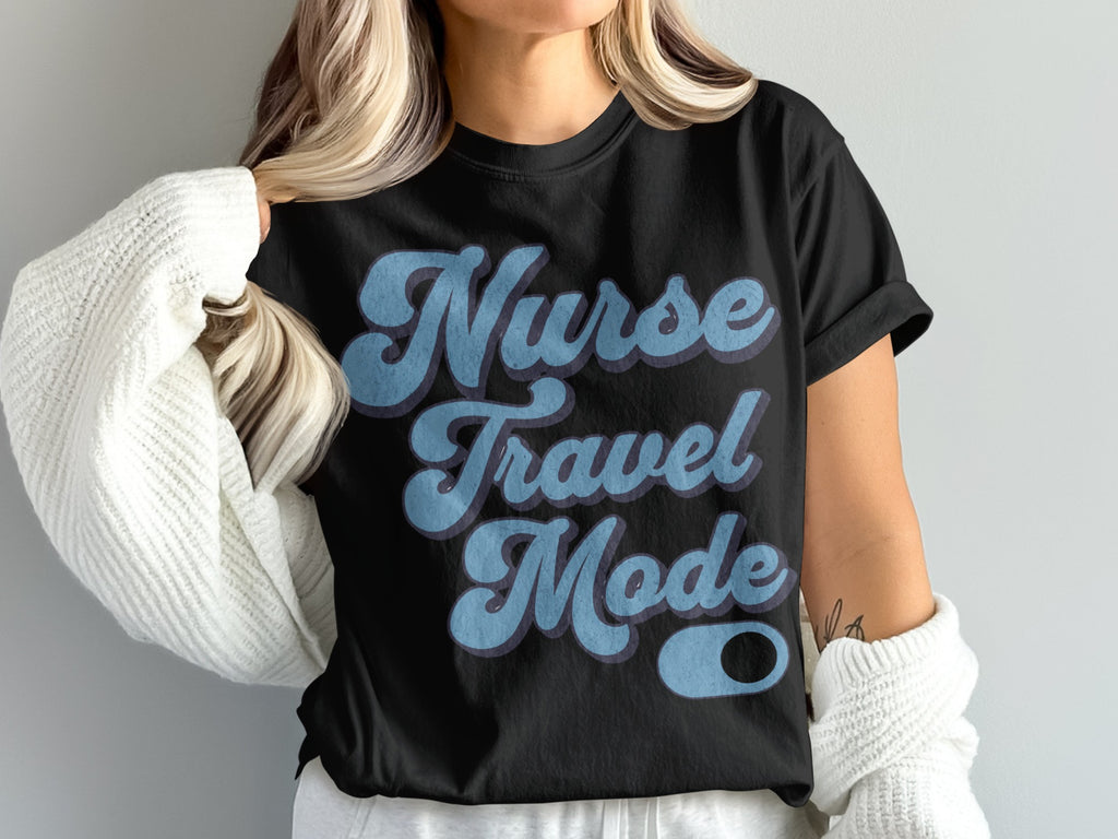 Black t-shirt with "Nurse Travel Mode" text in blue and purple gradient.