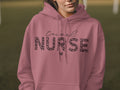 Pink hoodie with "Travel Nurse" text in leopard print.