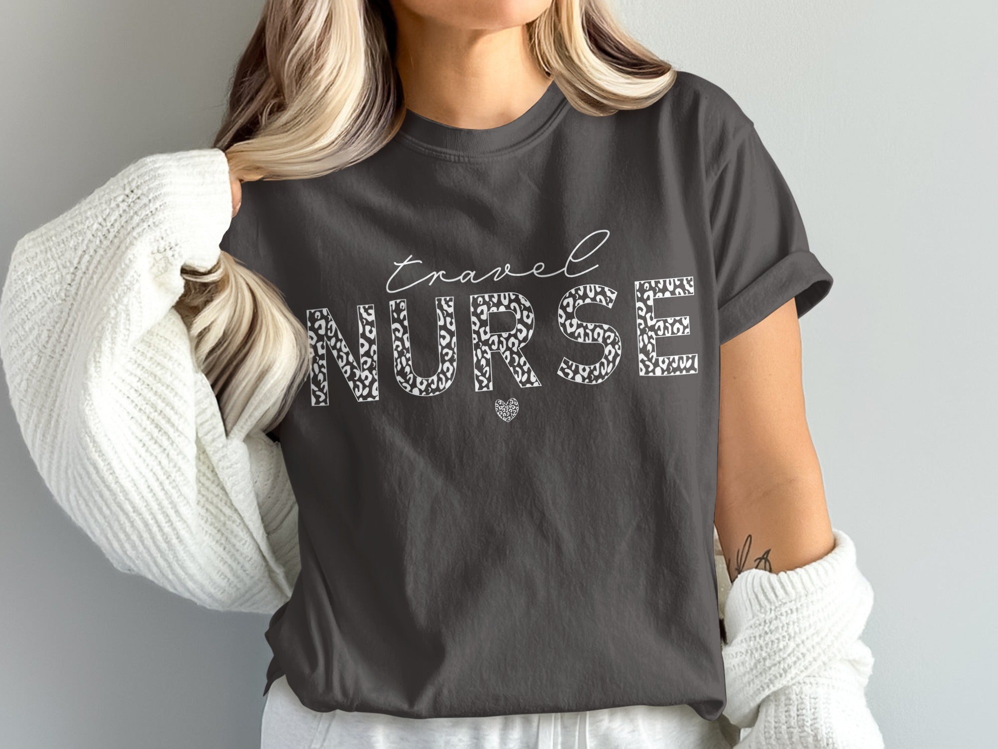 Gray t-shirt with "Travel Nurse" in white leopard print text and a small heart.