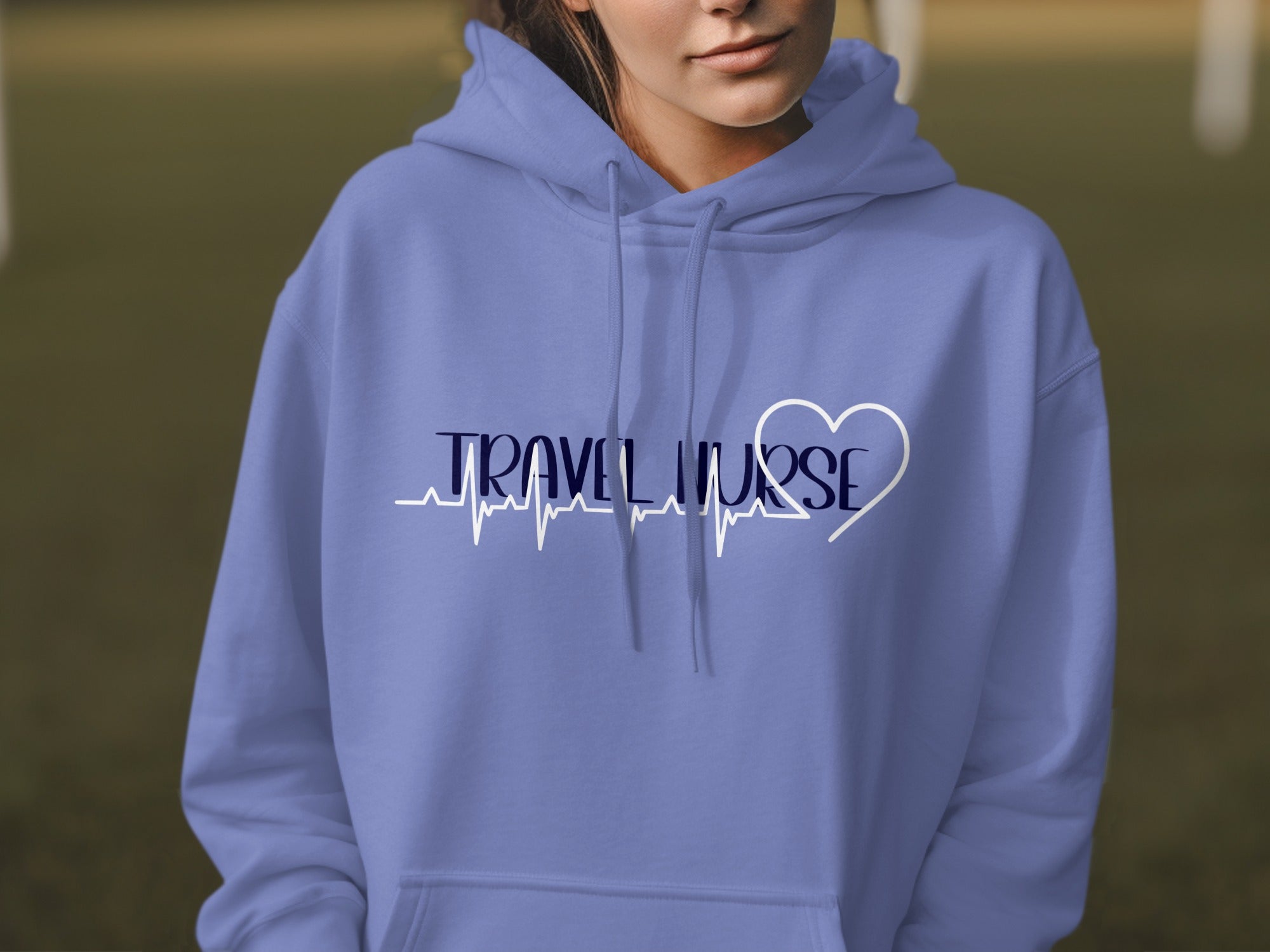 Periwinkle hoodie with "TRAVEL NURSE" text and heart-shaped ECG line.