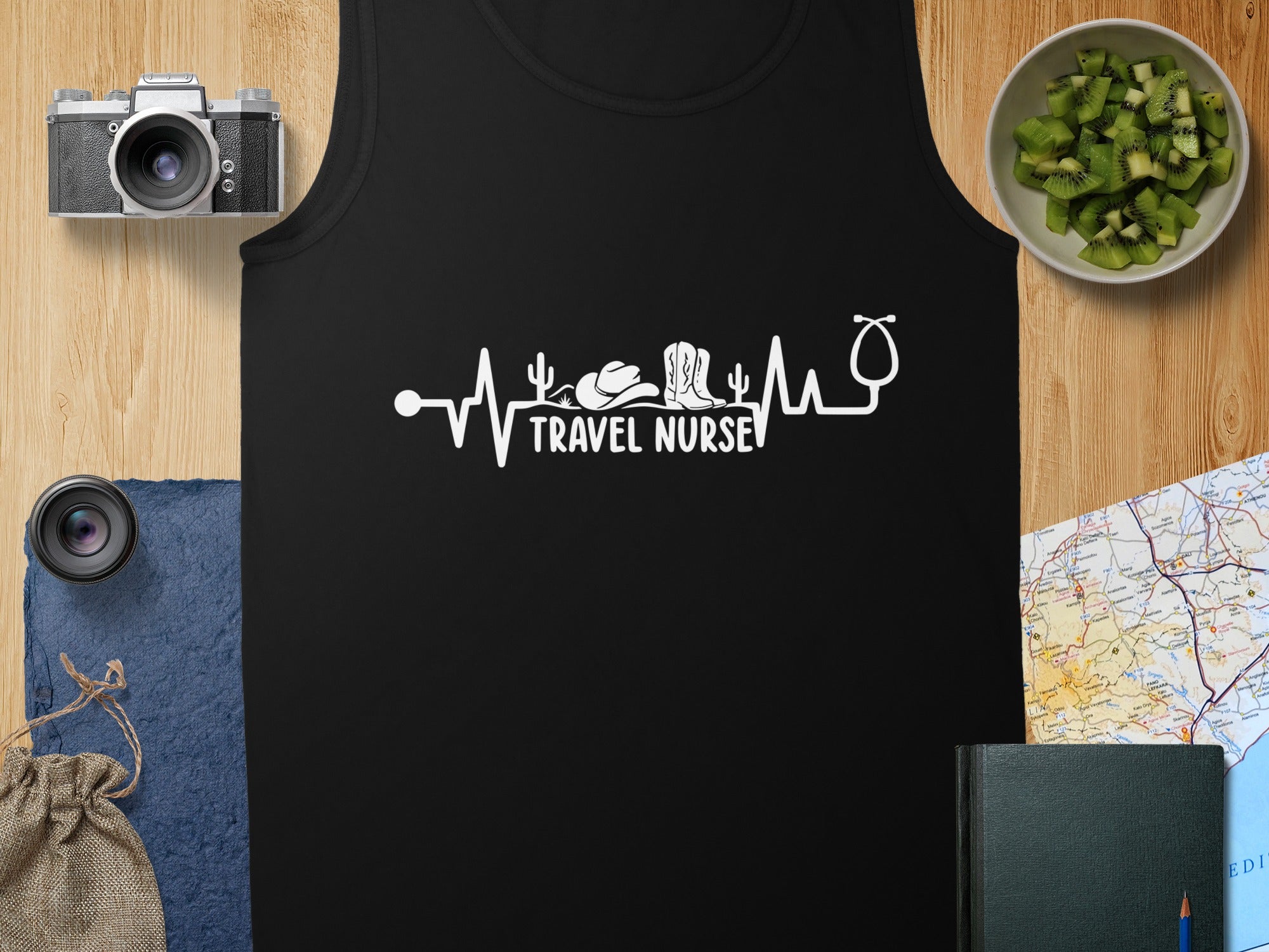 Black tank top with "Travel Nurse" text and stethoscope, cowboy hat, and medical symbol.