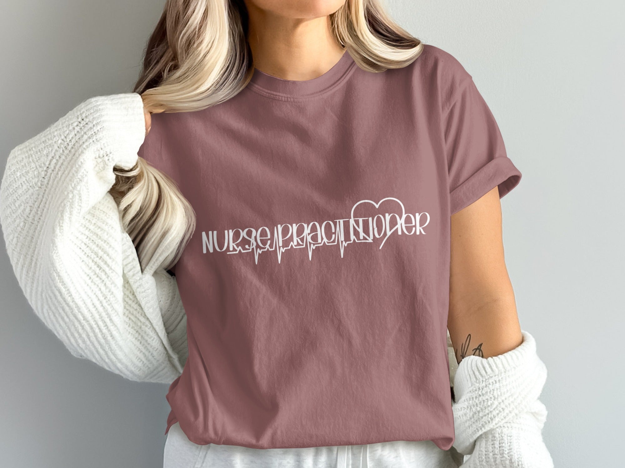 Mauve t-shirt with white "Nurse Practitioner" text and a heart rhythm design.