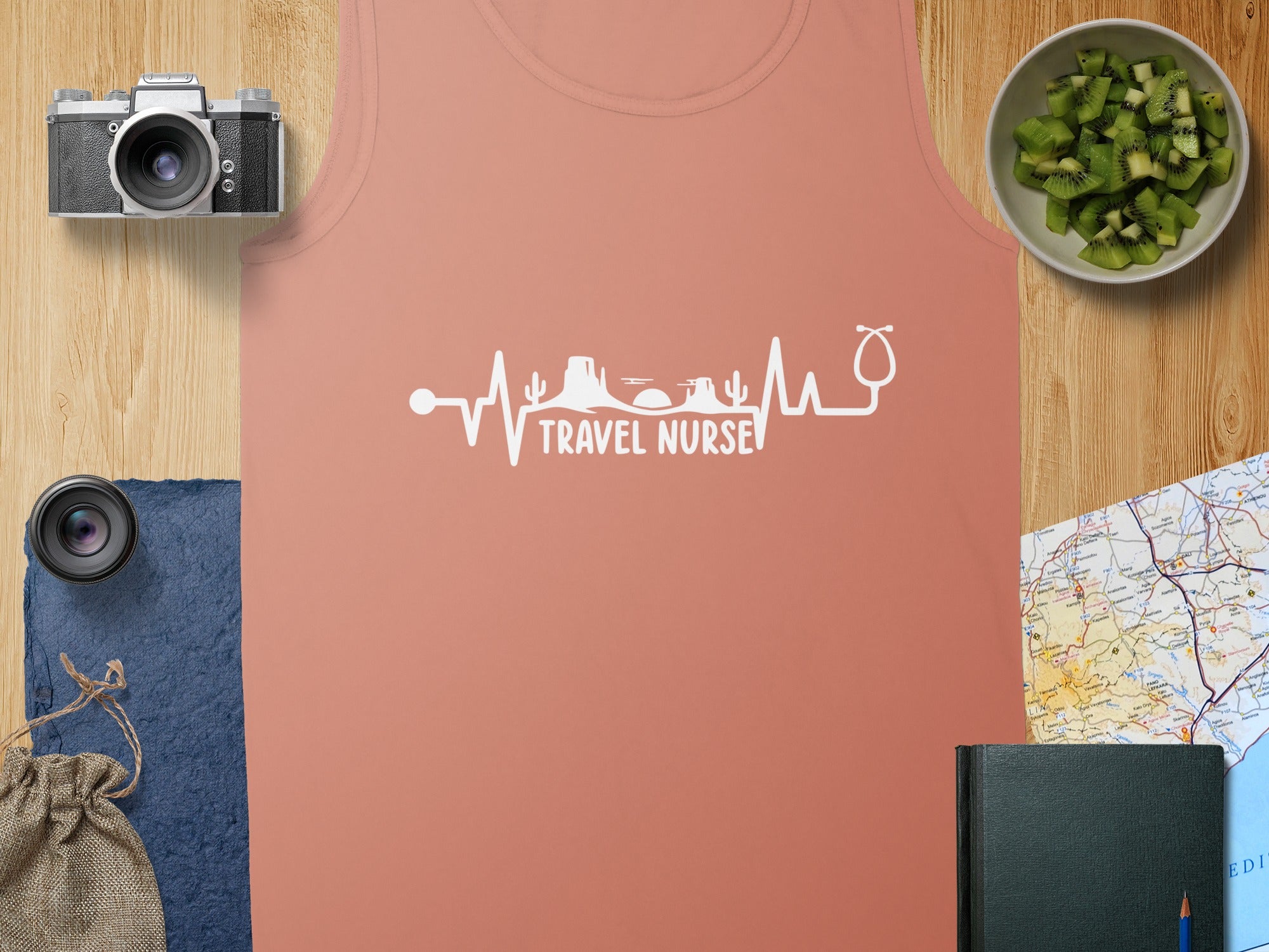 Coral tank top with "Travel Nurse" heartbeat and stethoscope graphic.