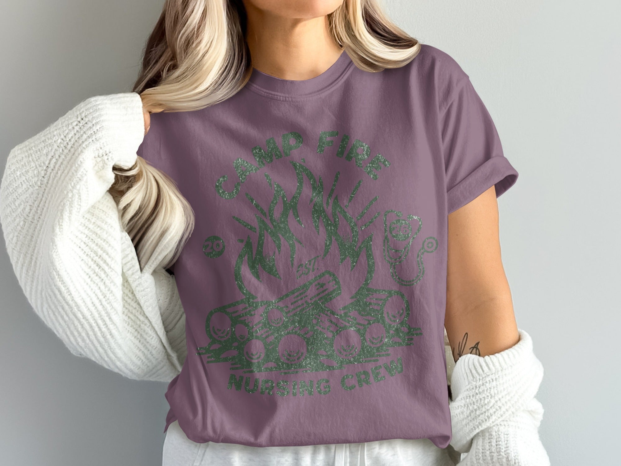 T-shirt with green campfire and "Camp Fire Nursing Crew" text.