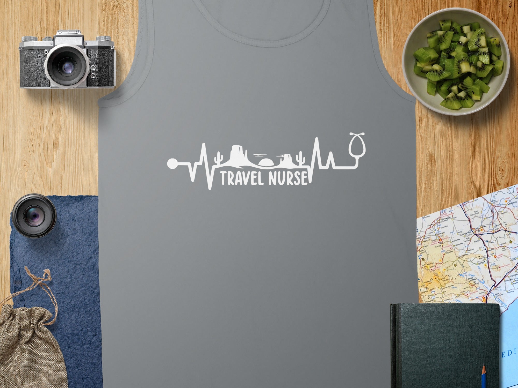 Grey tank top with "TRAVEL NURSE" heartbeat and stethoscope logo.