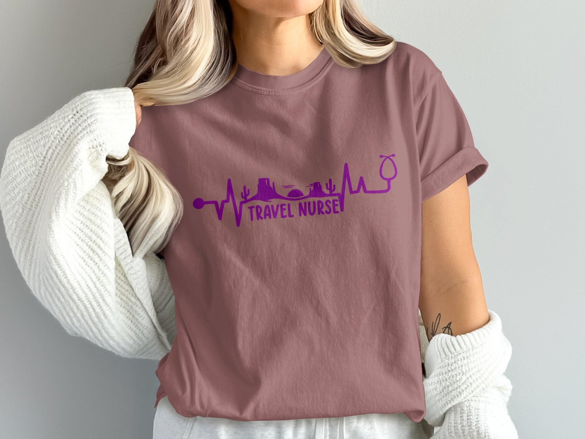 Purple t-shirt with "TRAVEL NURSE" and desert silhouette on a heartbeat line.