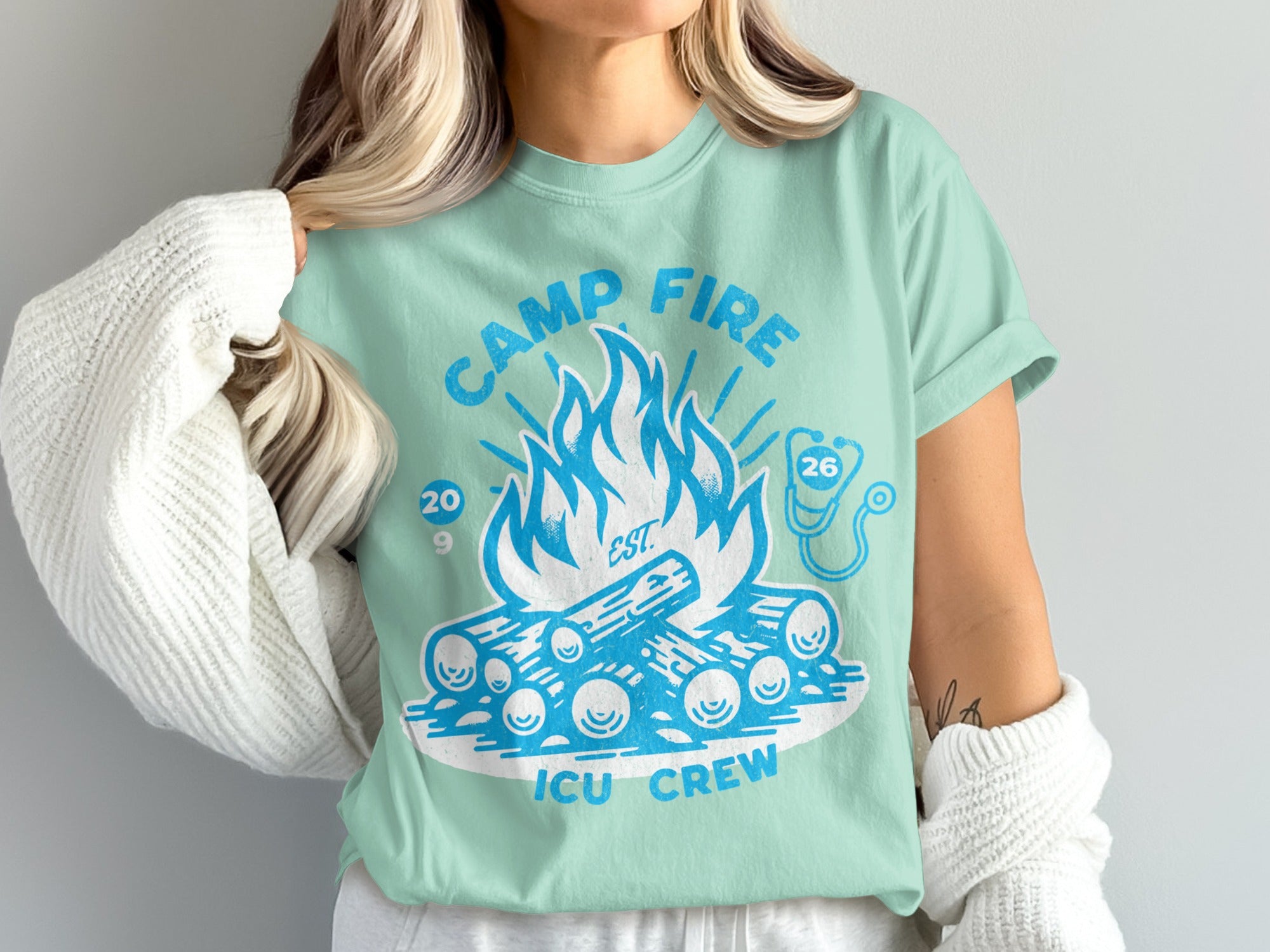 Mint t-shirt with "Camp Fire ICU Crew" text and campfire graphic.
