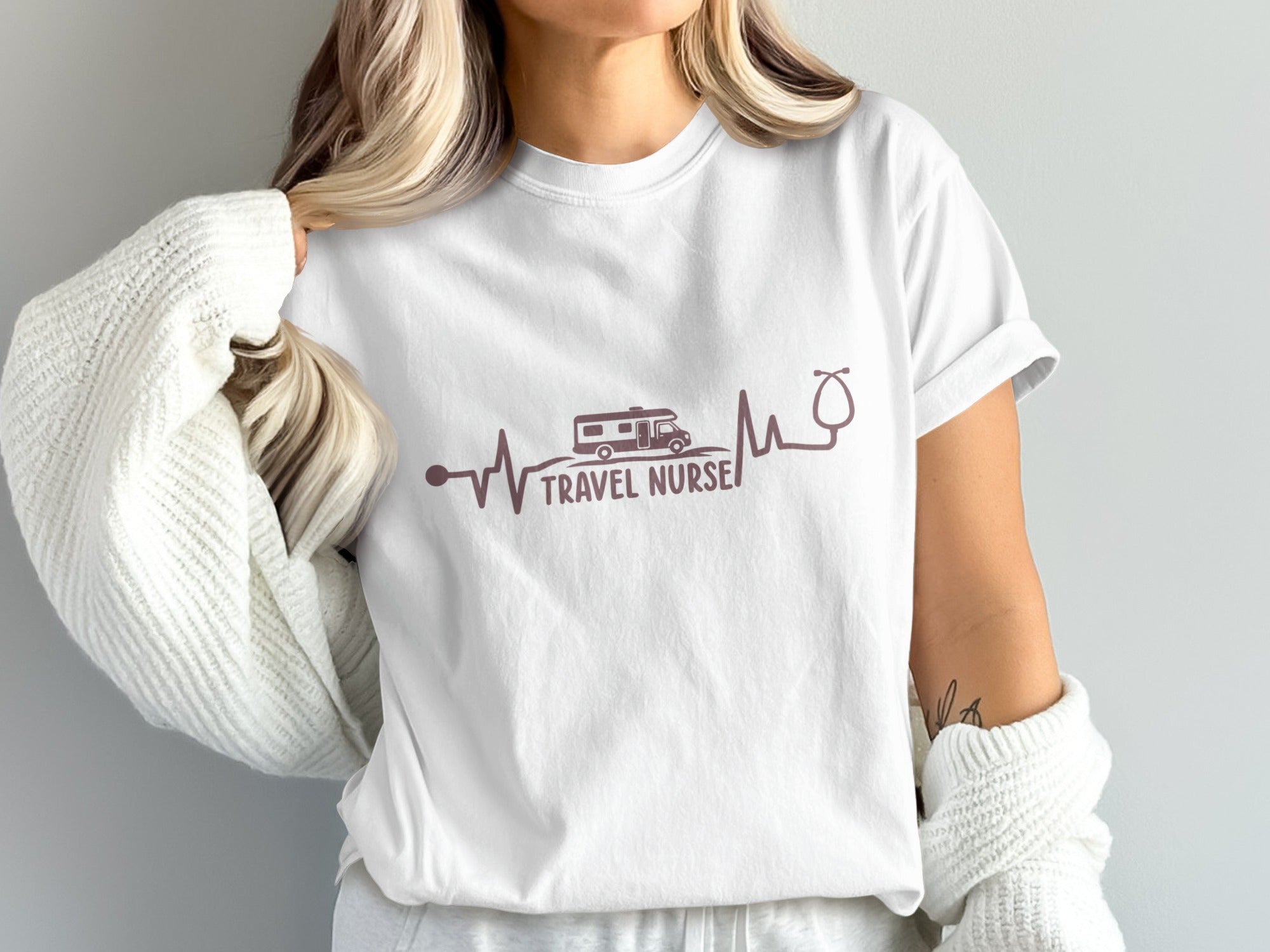 White t-shirt with "TRAVEL NURSE" text and RV and stethoscope design.
