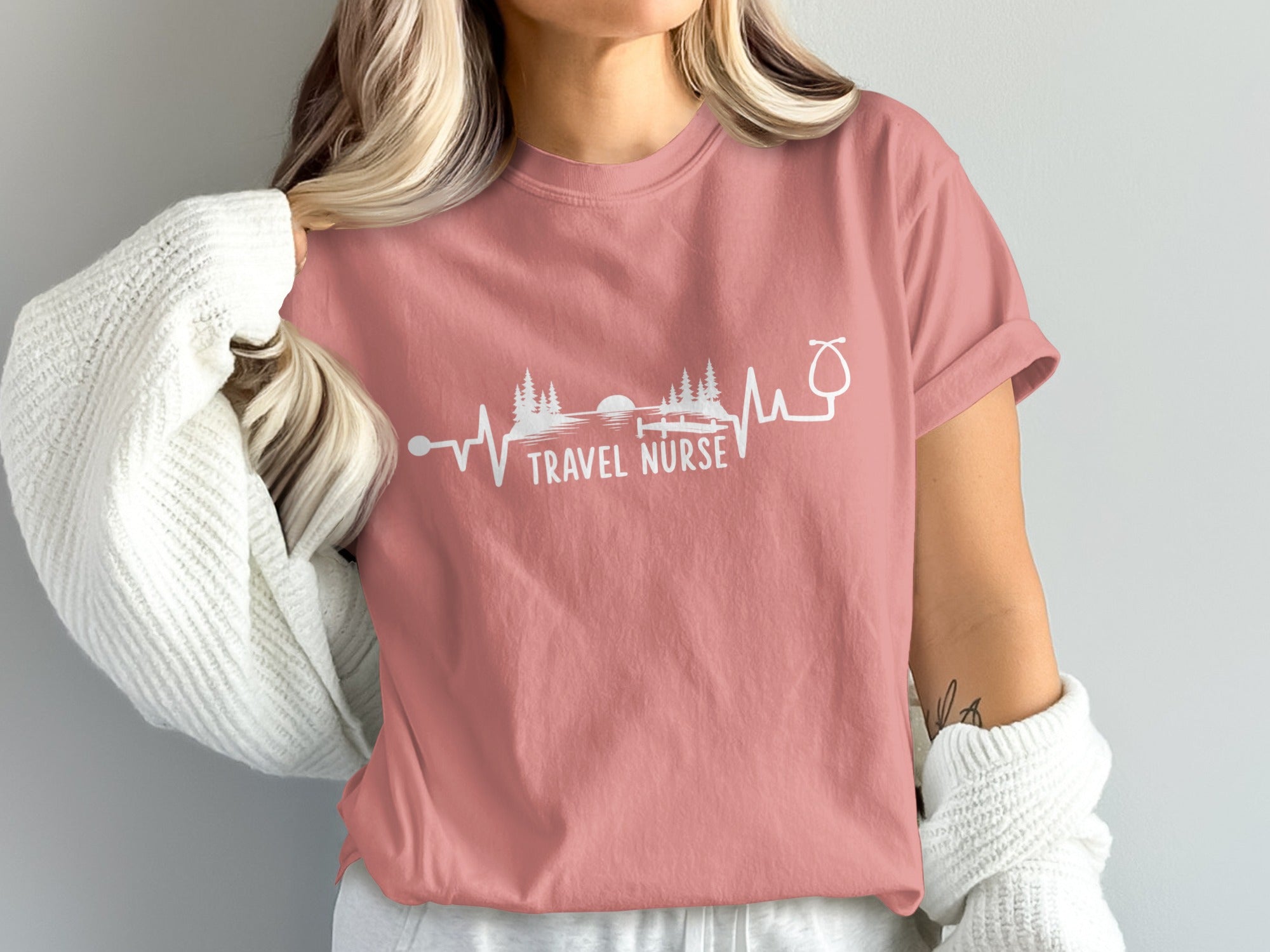 Pink t-shirt with "Travel Nurse" and heartbeat graphic.