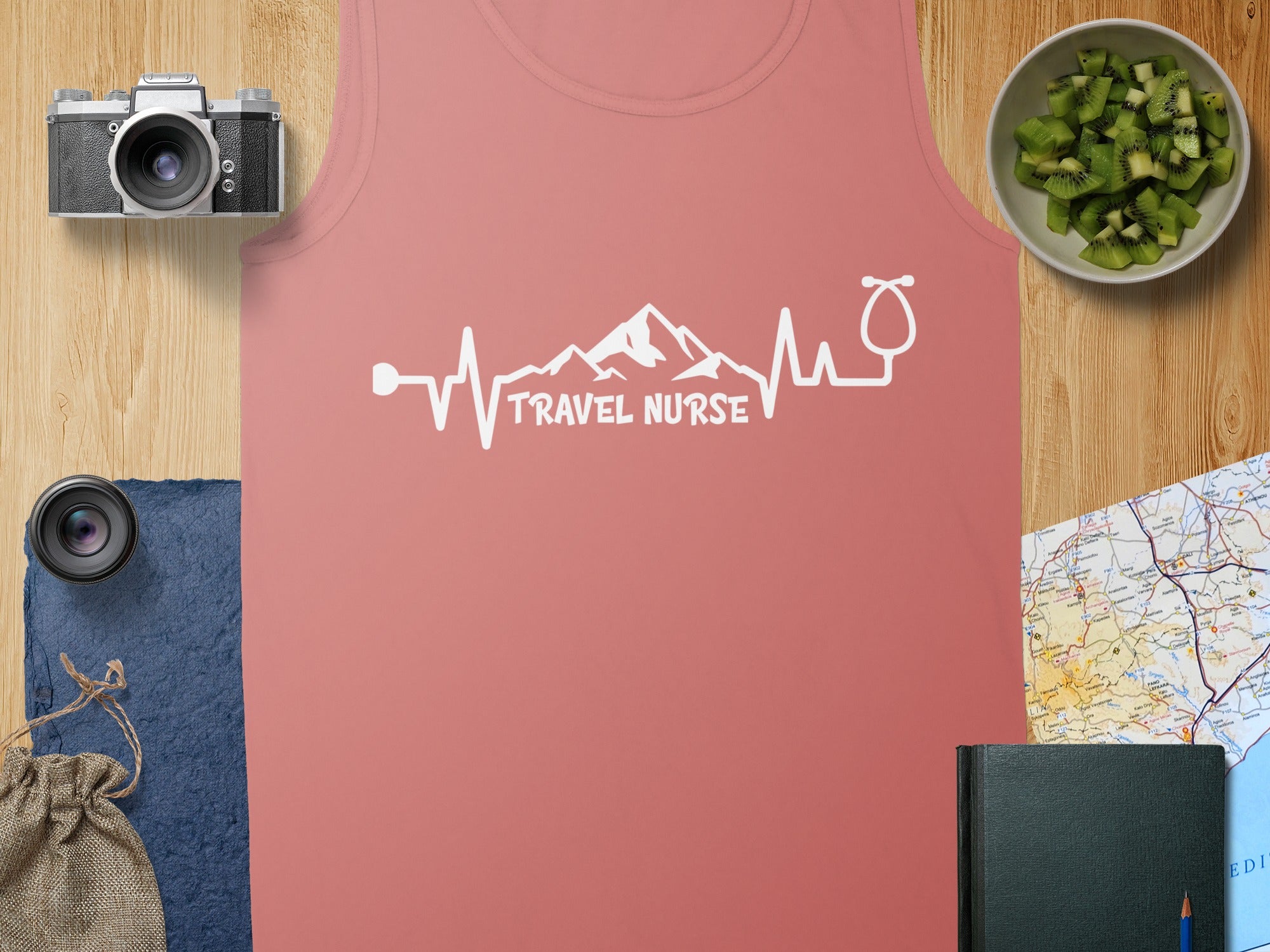 Pink tank top with "Travel Nurse" in a heartbeat and stethoscope graphic.
