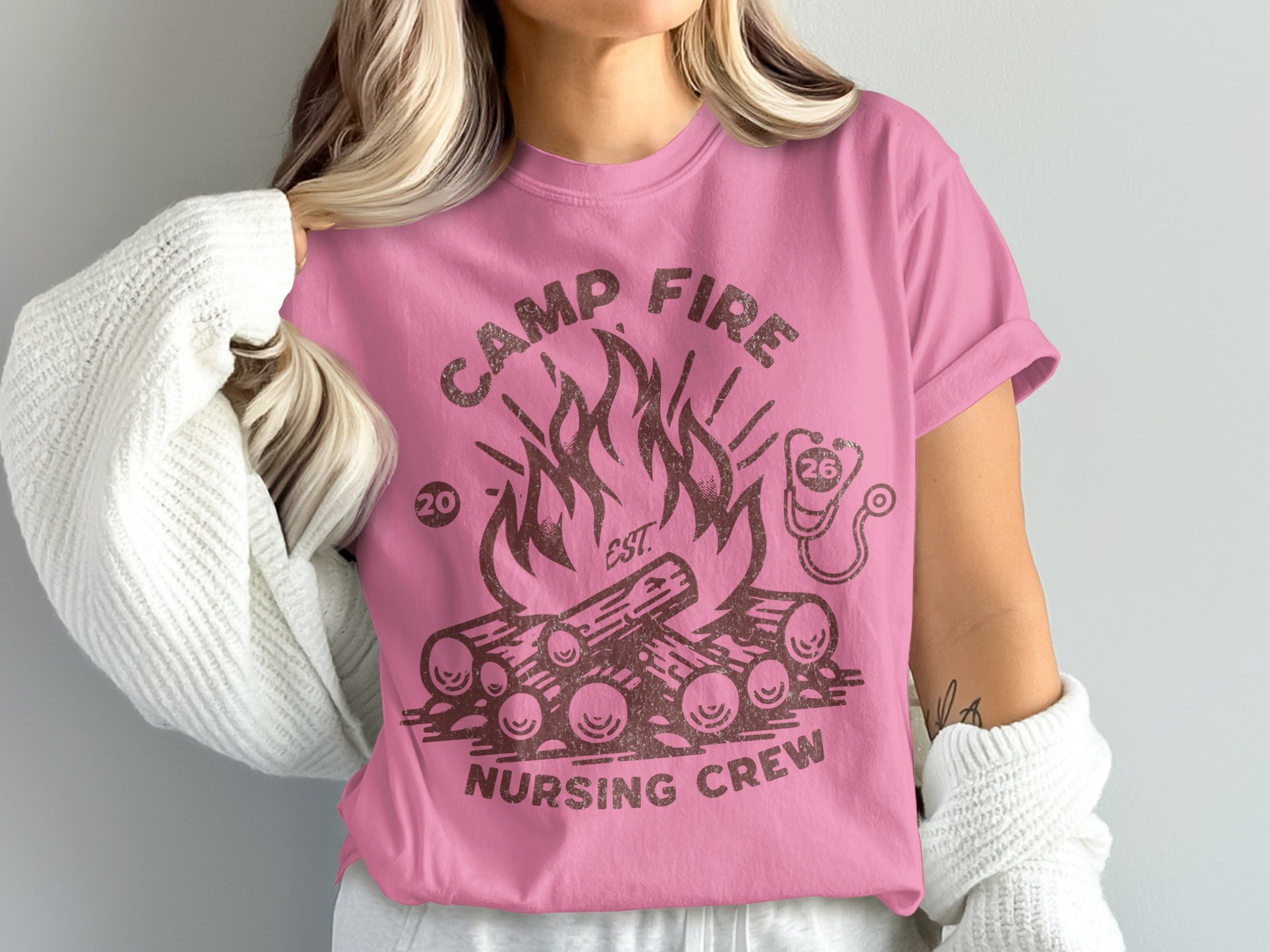 Pink t-shirt with "Camp Fire Nursing Crew" text and campfire graphic.