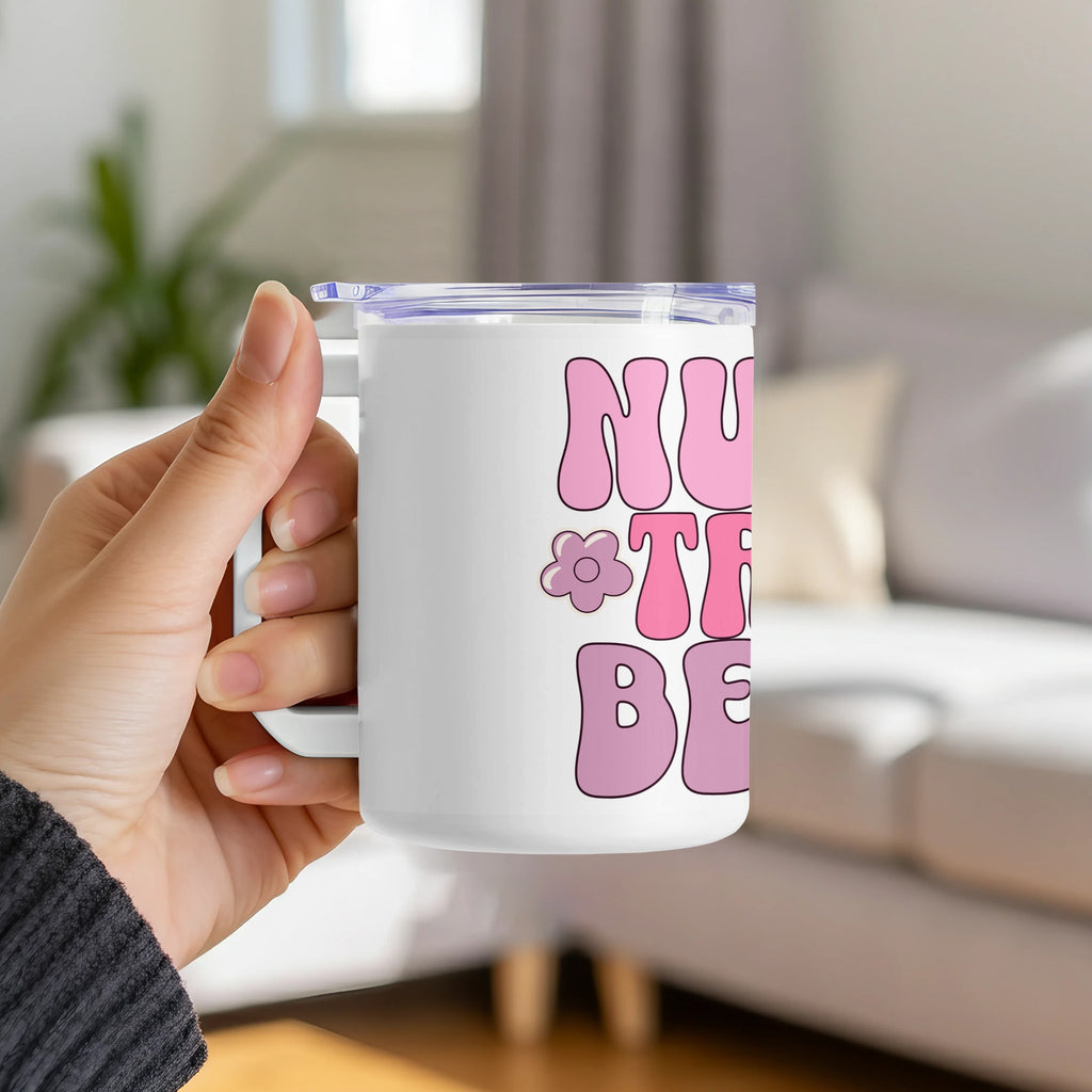 White mug with "NURSE THE BEST" and floral design in pink.