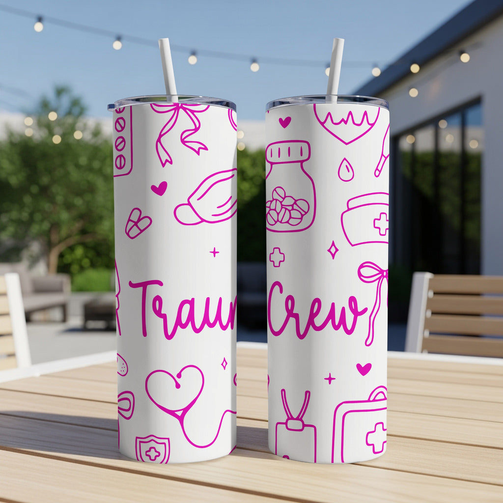 White tumblers with pink medical icons and "Trauma Crew" text.
