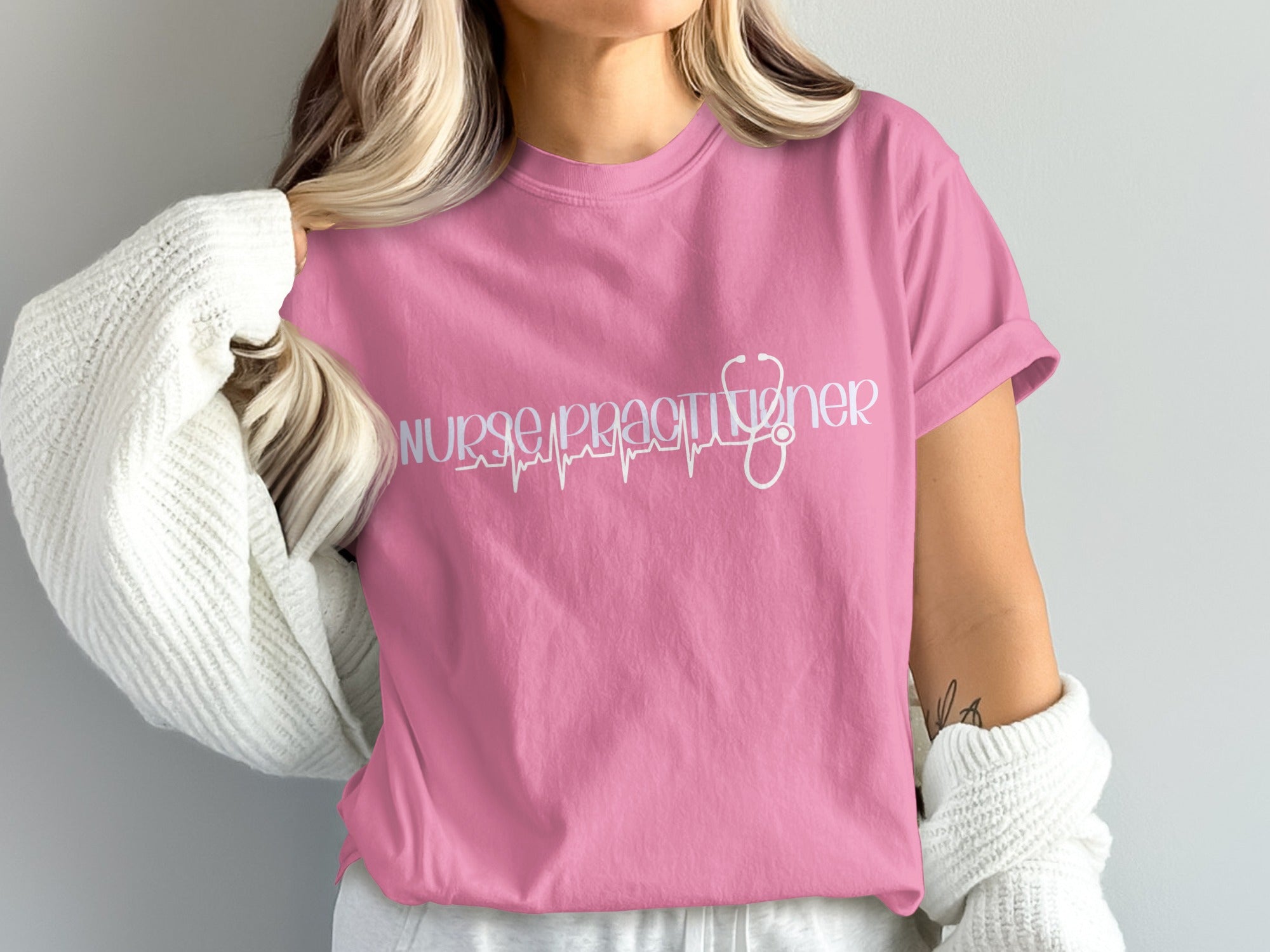 Pink t-shirt with "Nurse Practitioner" text in stethoscope design.