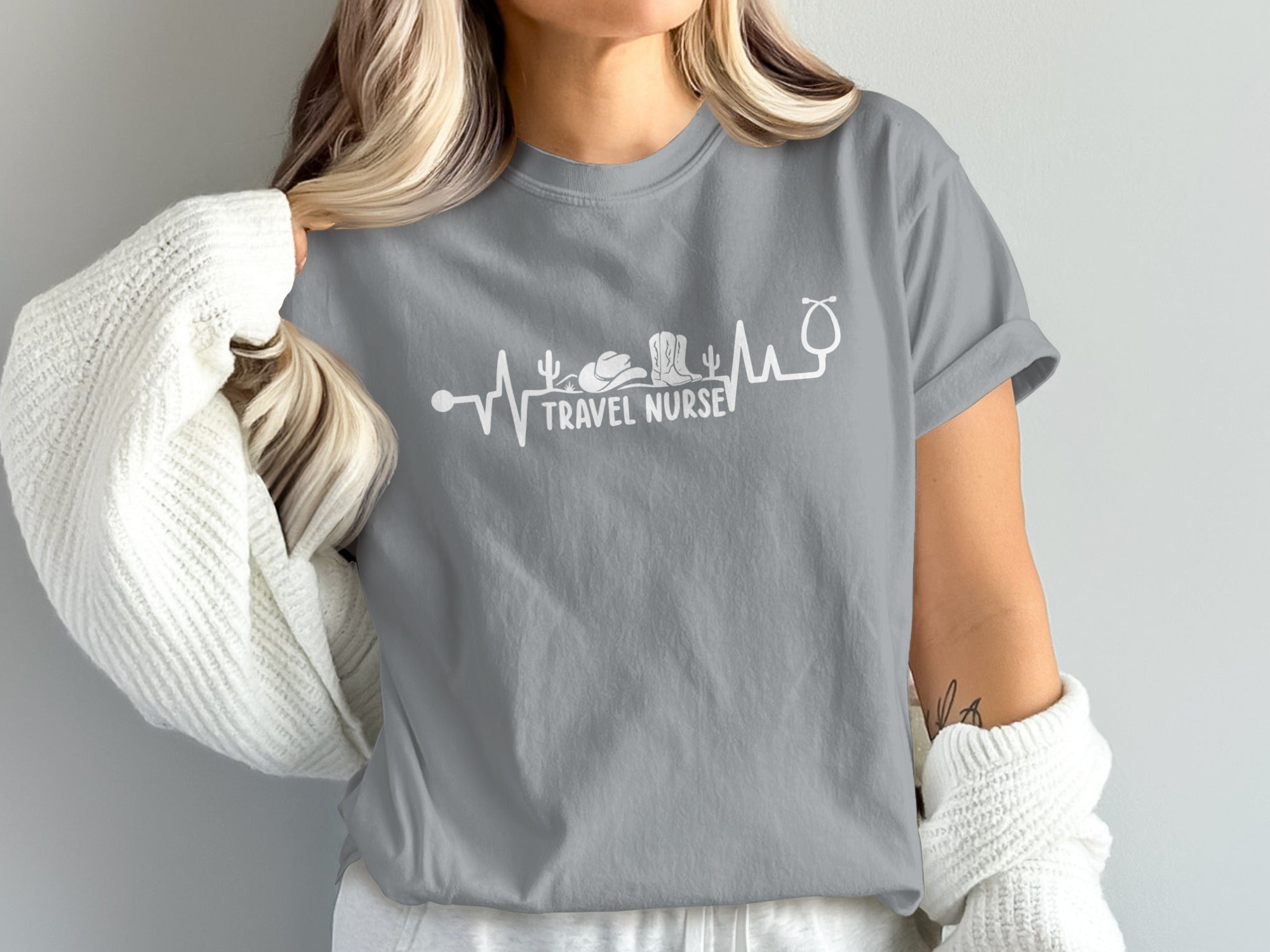 Grey t-shirt with white heartbeat graphic and "Travel Nurse" text.