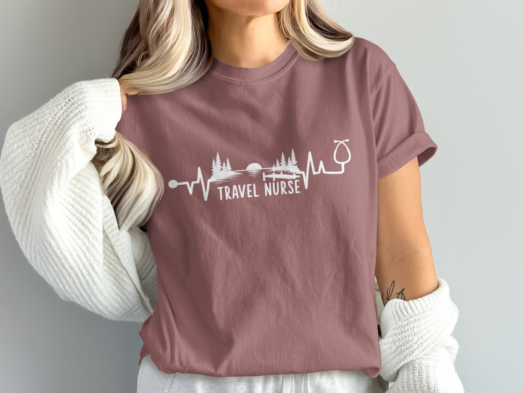 T-shirt with "TRAVEL NURSE" text and stethoscope heartbeat graphic.