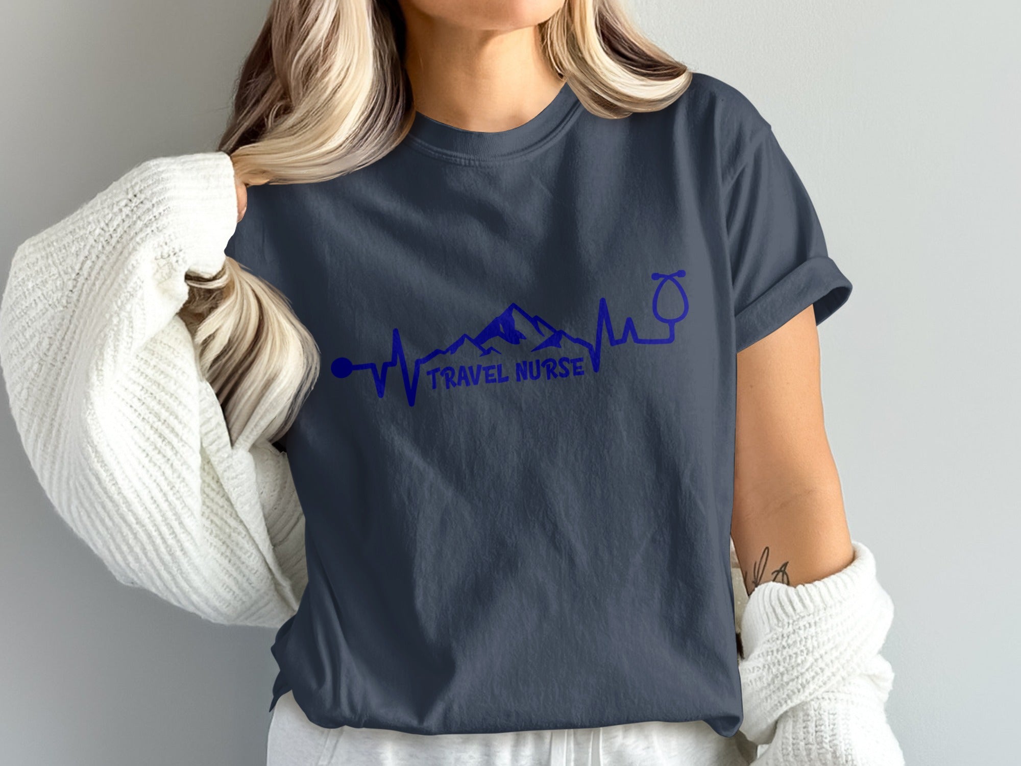 Navy t-shirt with "TRAVEL NURSE" text, mountain, and stethoscope design.
