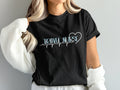 Black t-shirt with "TRAVEL NURSE" and a heartbeat graphic.