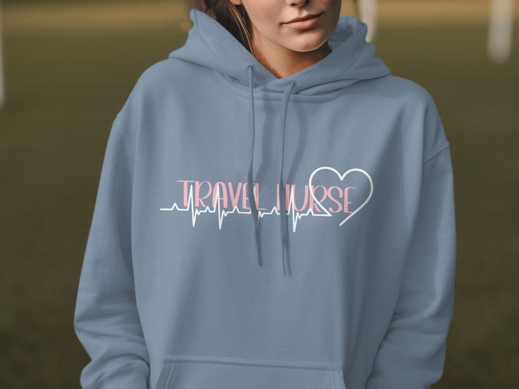 Blue hoodie with "TRAVEL NURSE" text and a heart over a heartbeat line.