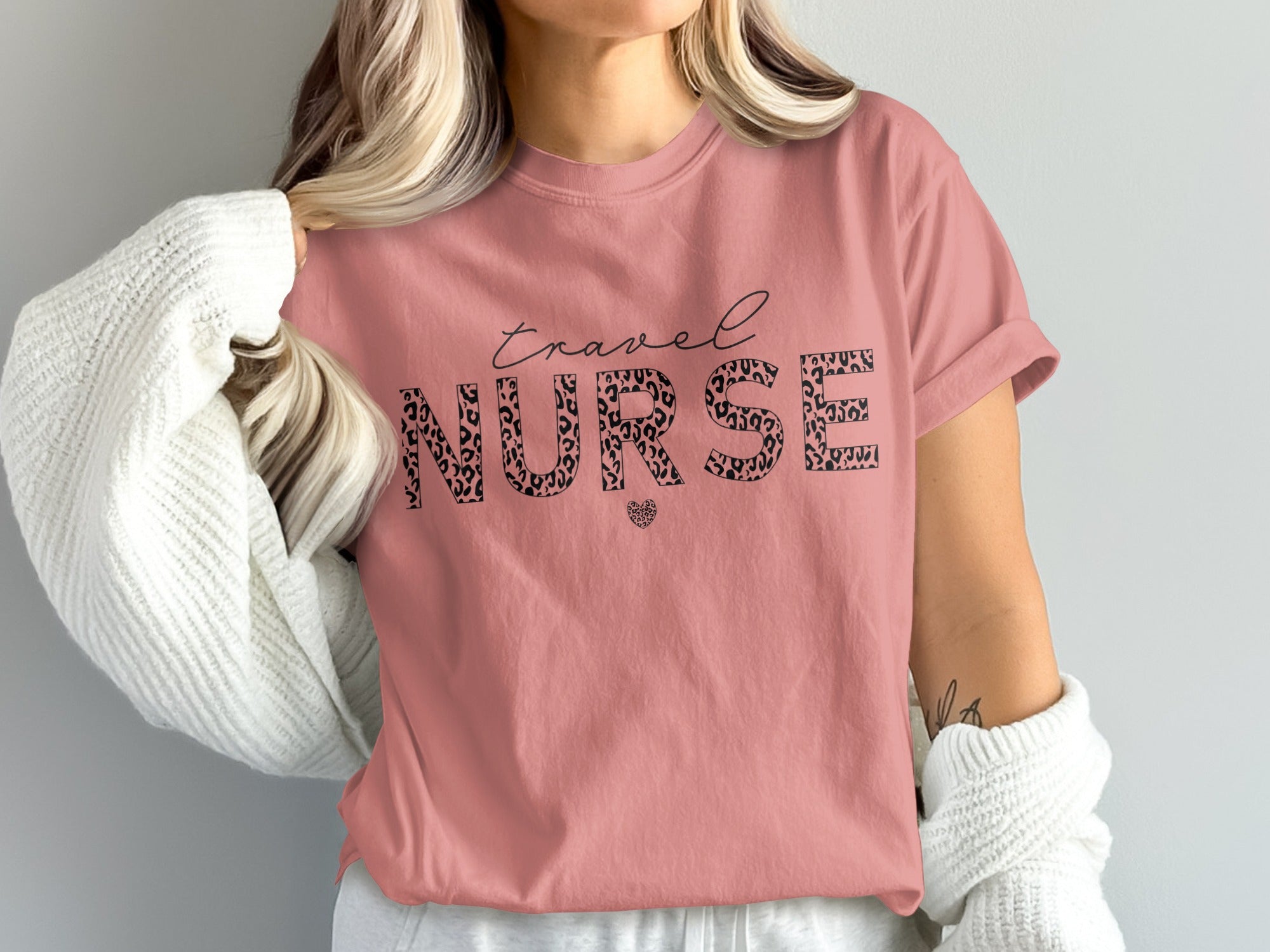 Pink t-shirt with "travel NURSE" text in leopard print and a heart.