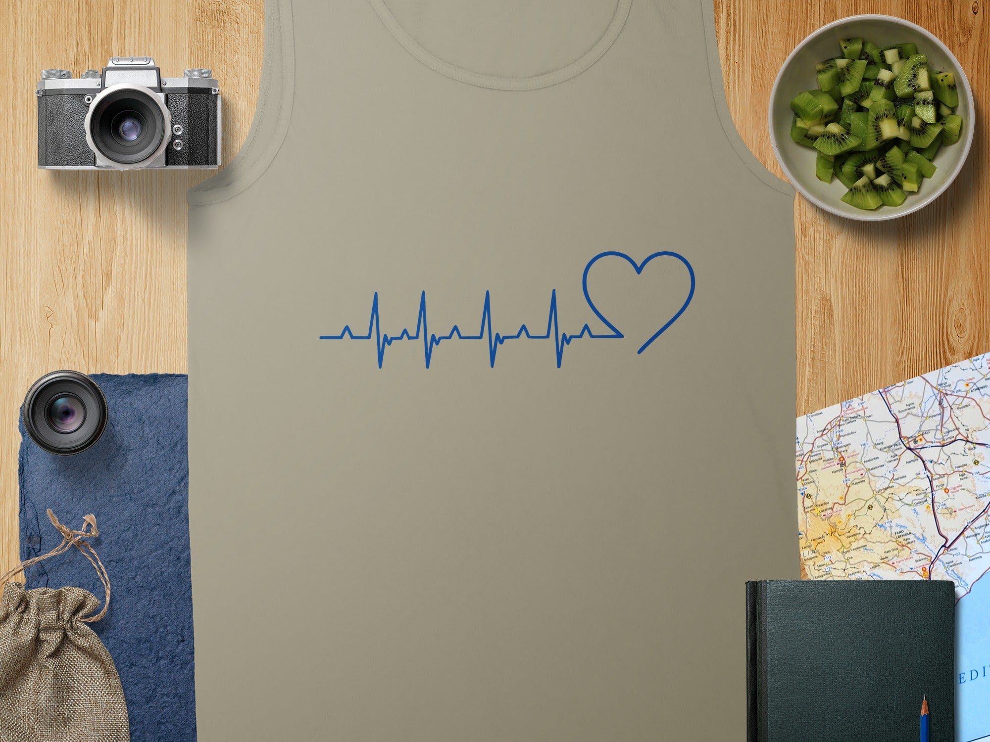 Tan tank top with blue heart-shaped electrocardiogram design.