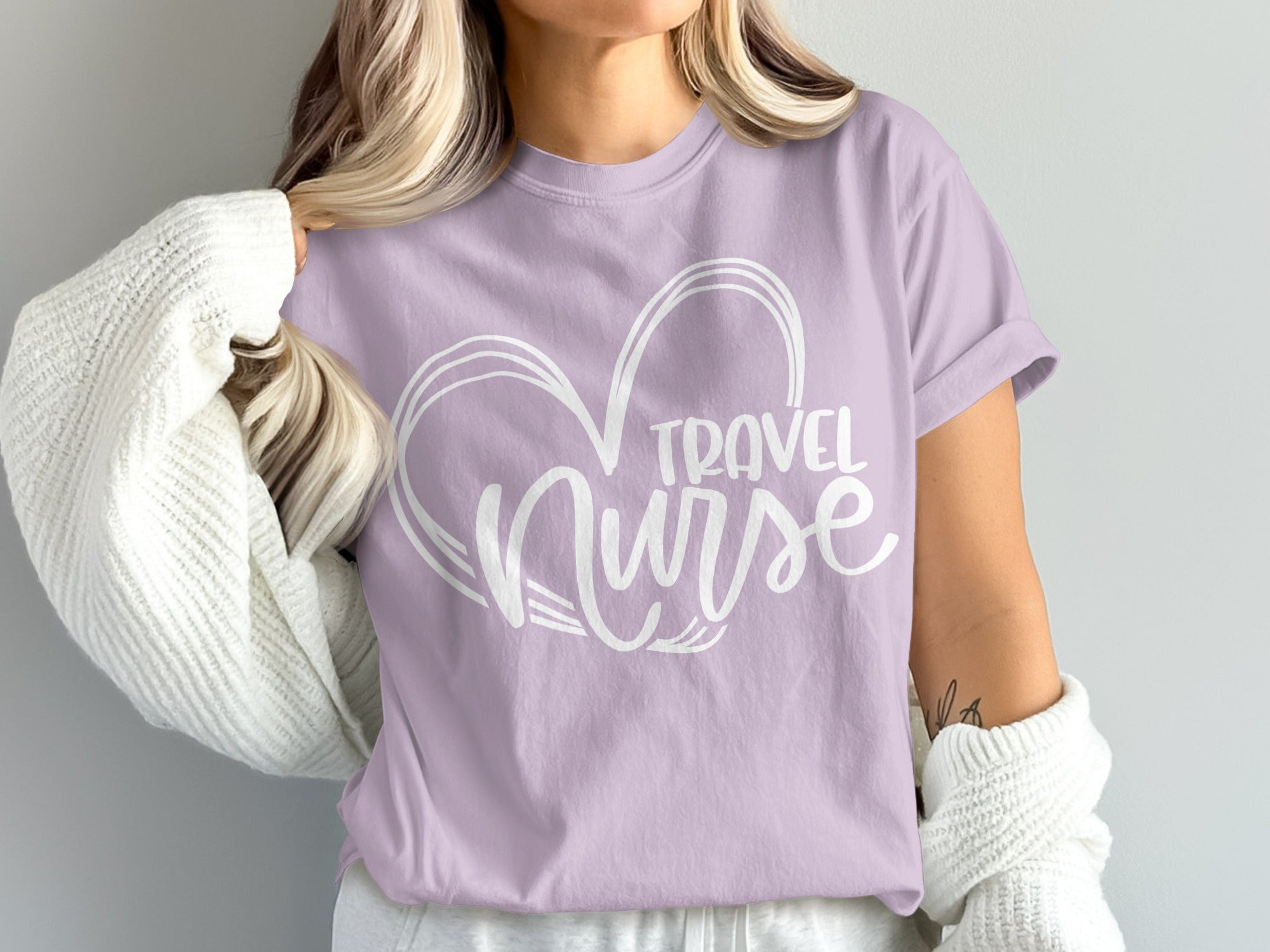 Lavender t-shirt with white "Travel Nurse" heart graphic.