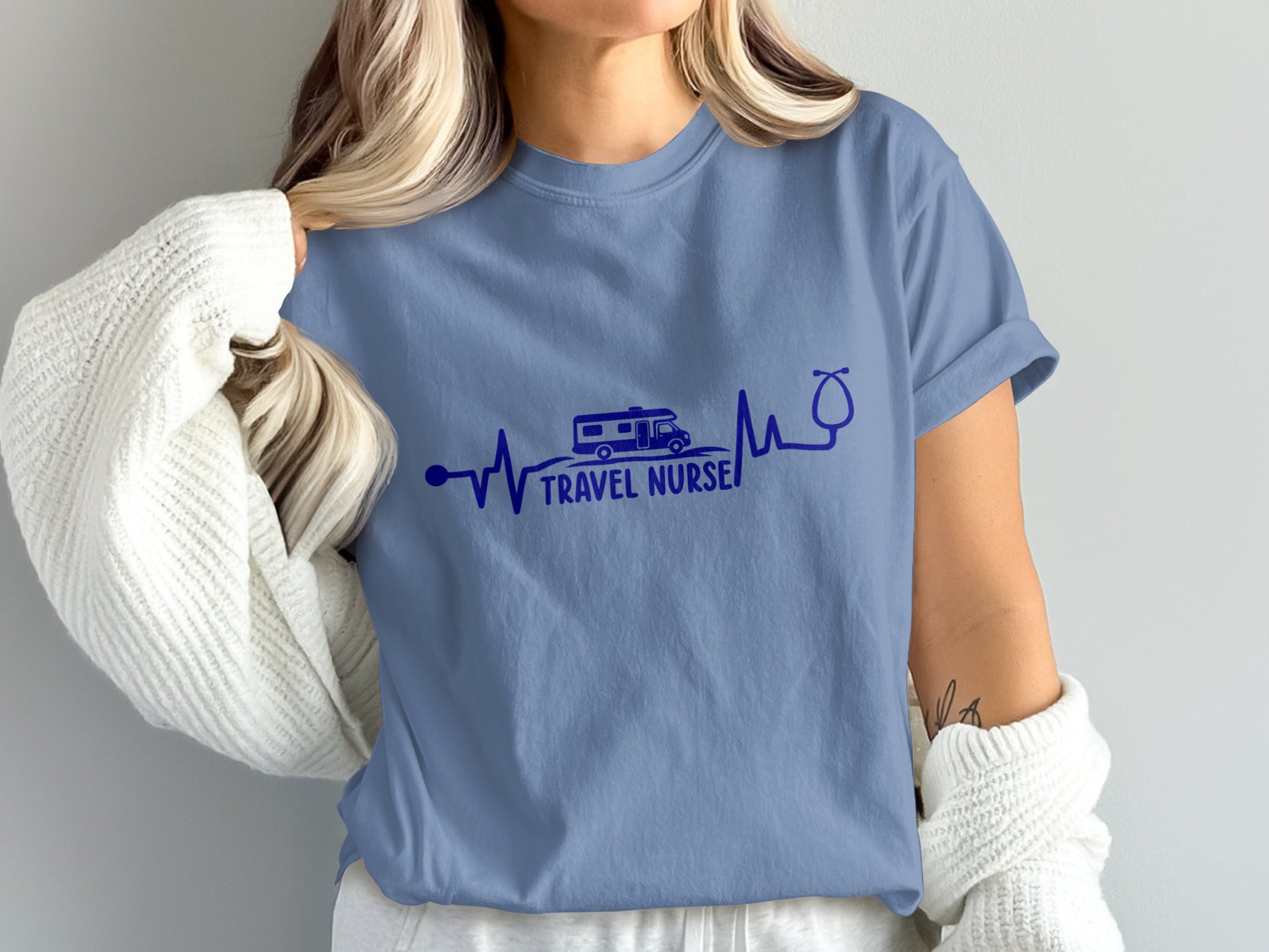 Blue t-shirt with RV and stethoscope heartbeat graphic and "Travel Nurse" text.