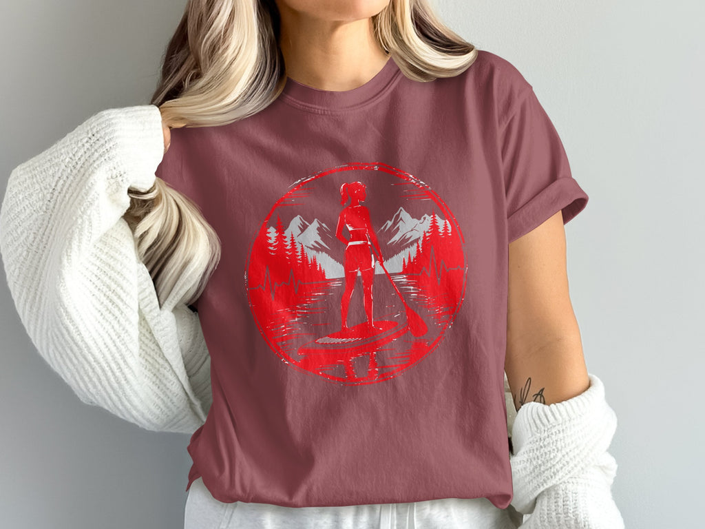 Red circular graphic of a woman paddleboarding with mountains and trees.