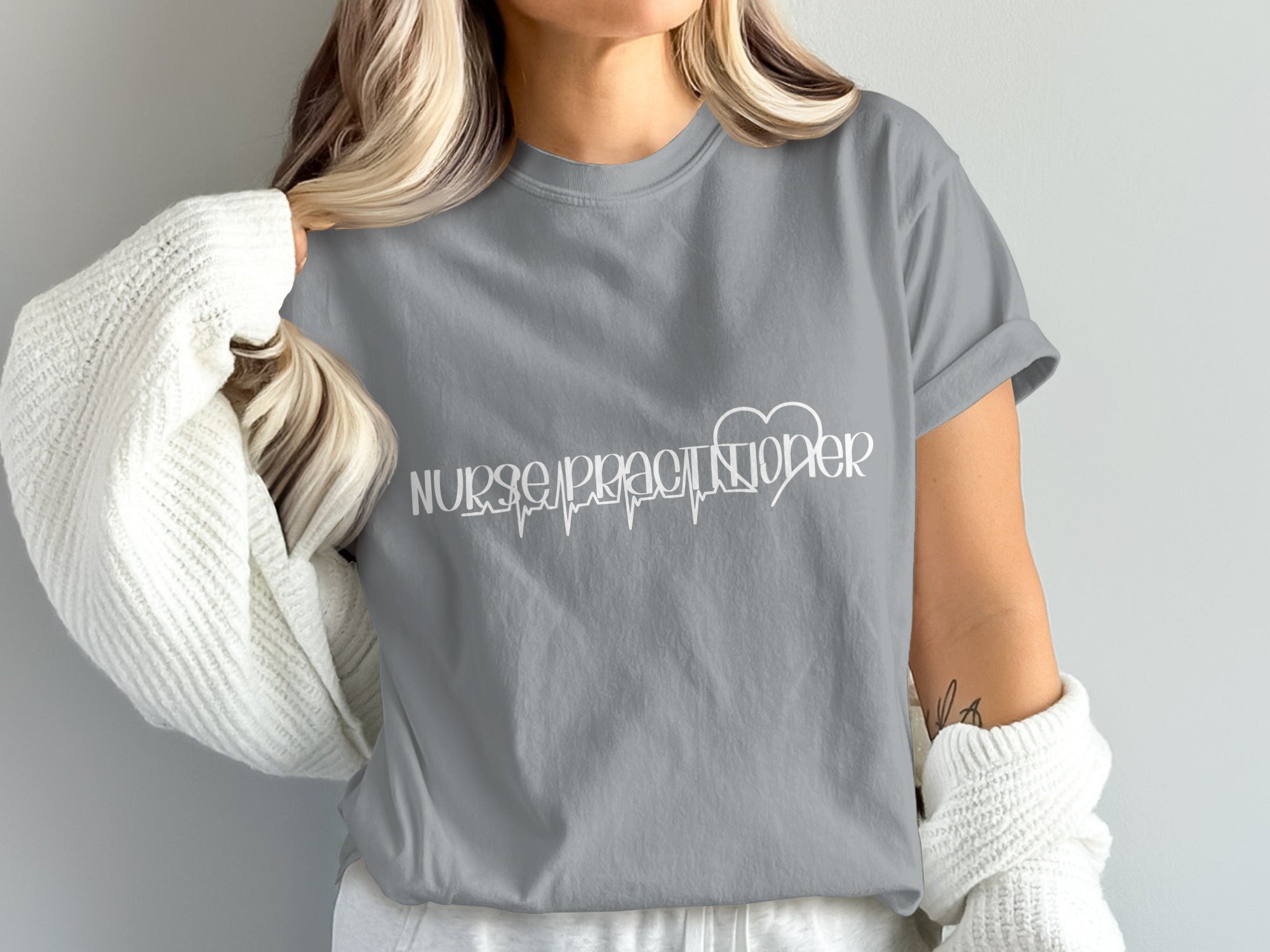 Grey t-shirt with "Nurse Practitioner" text and a heartbeat EKG line.