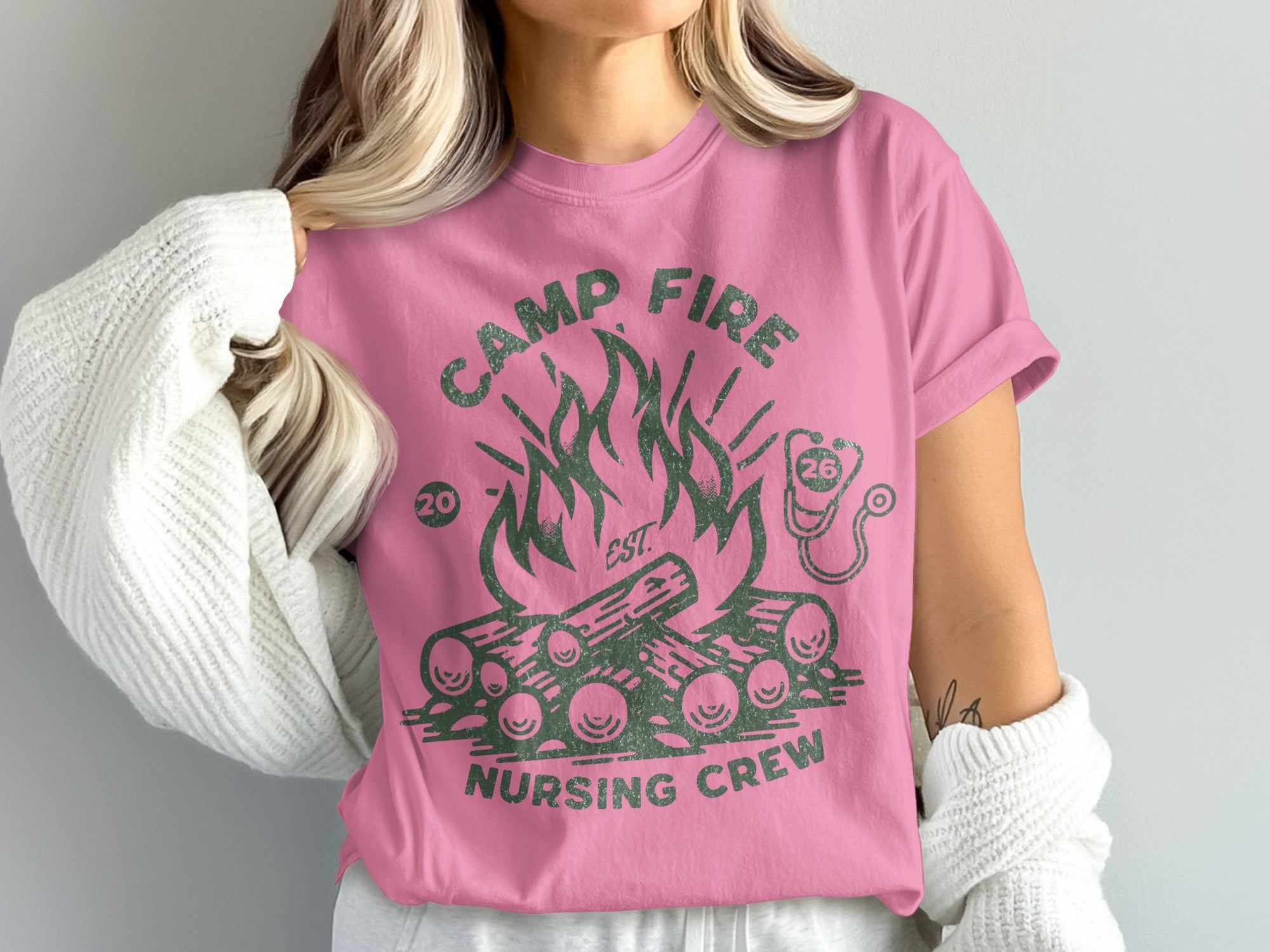 Pink t-shirt with campfire and "Camp Fire Nursing Crew" text.