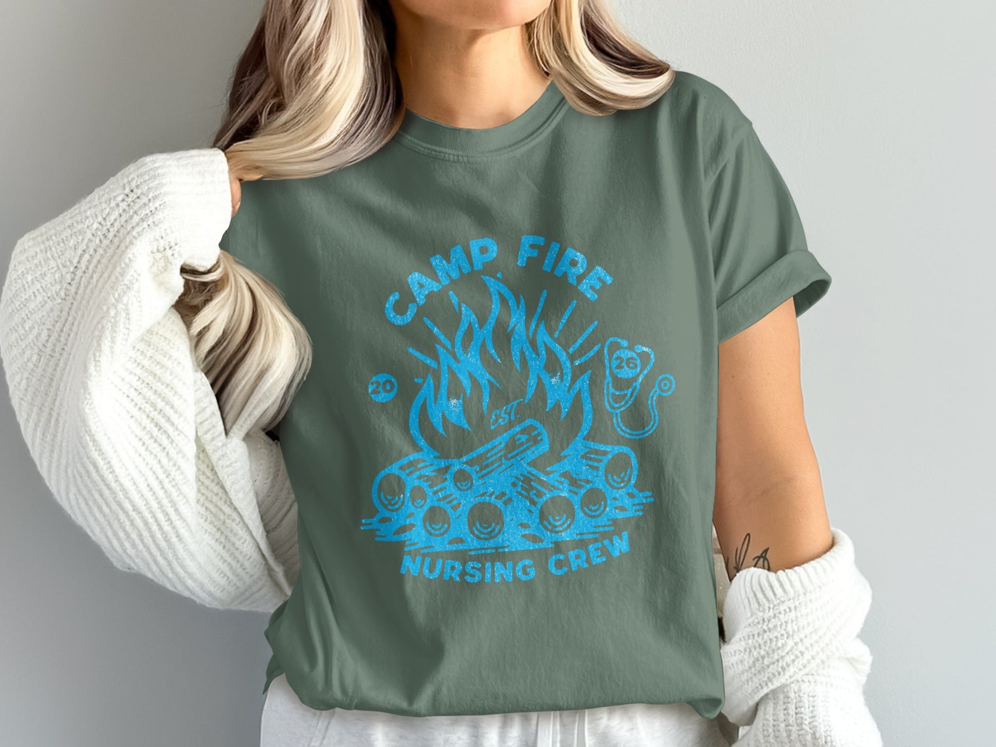 Camp Fire Nursing Crew graphic tee with blue flames and logs.
