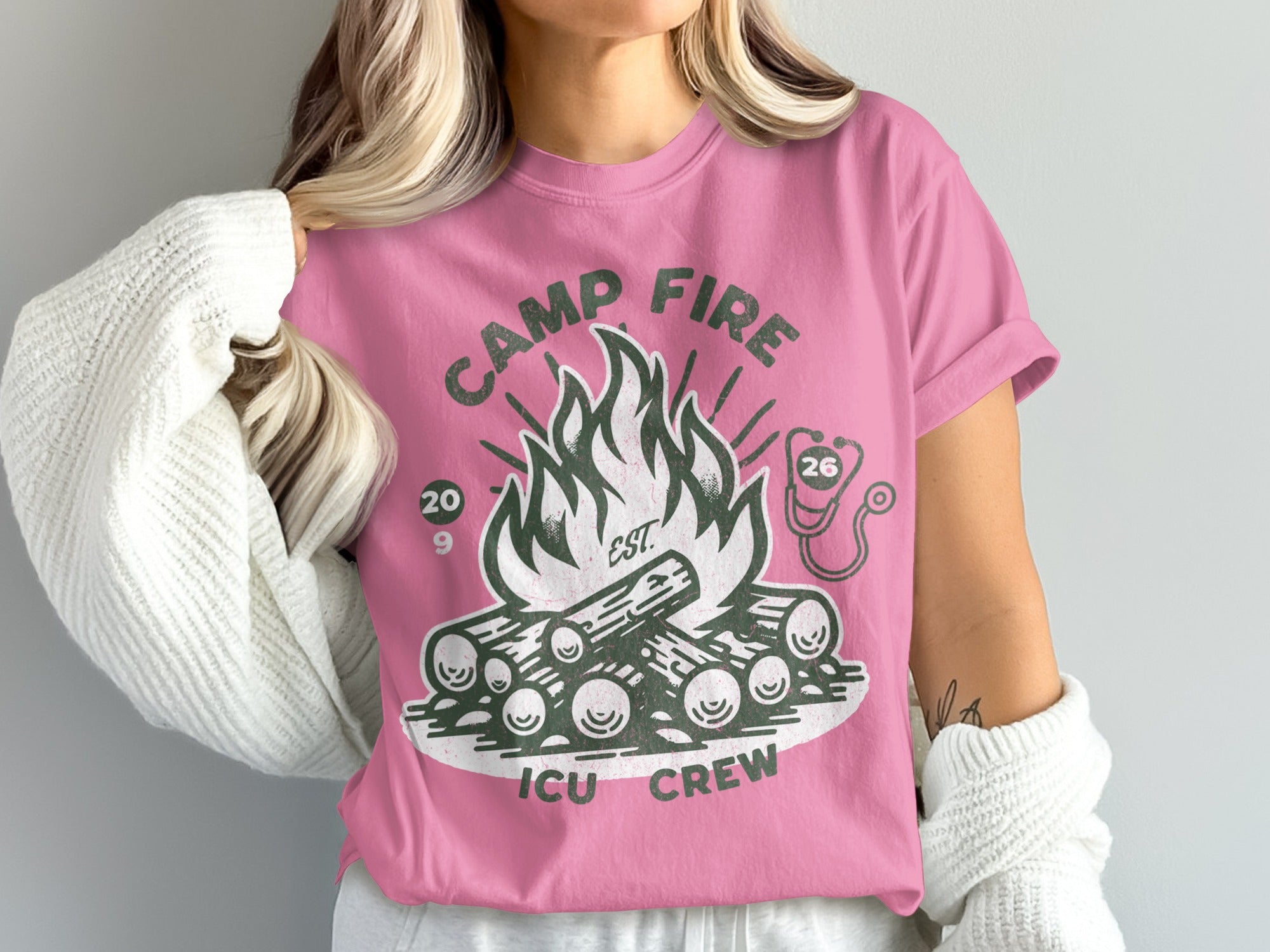 Pink t-shirt with campfire and "Camp Fire ICU Crew" text.