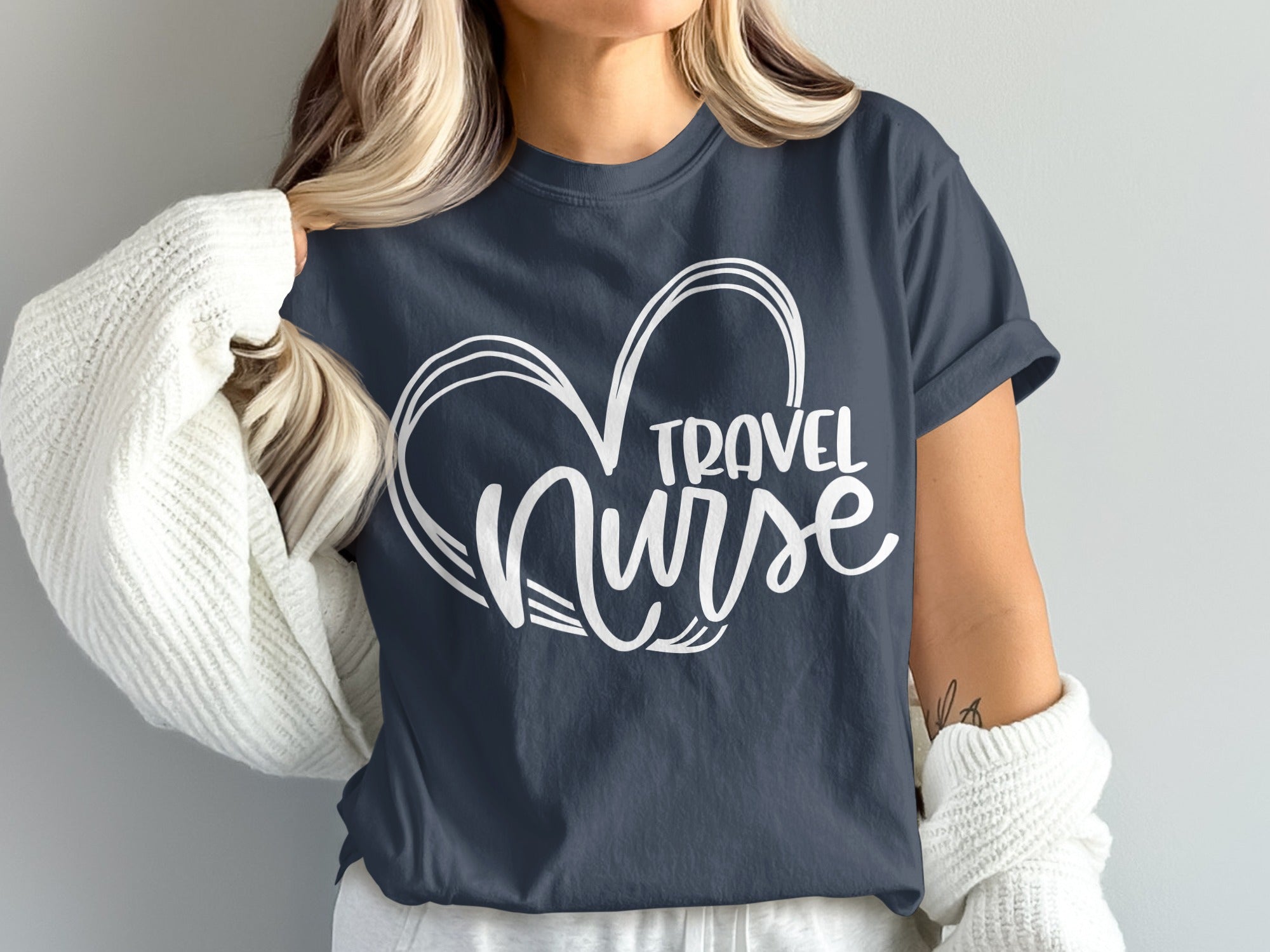 Dark blue t-shirt with white heart and "Travel Nurse" text design.