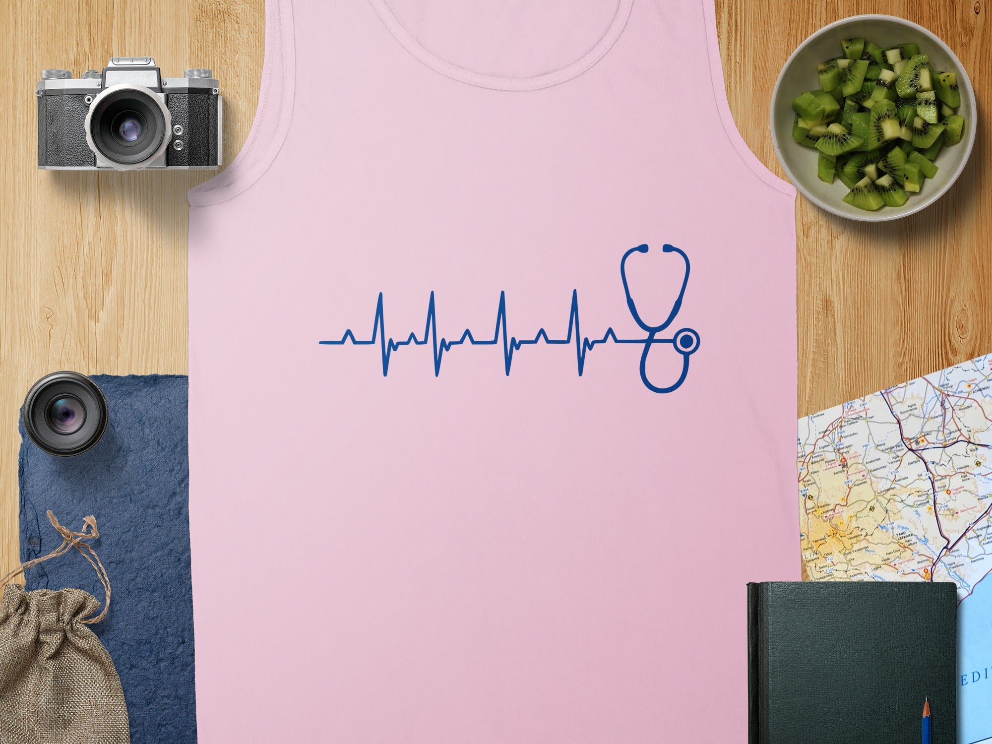 Pink tank top with a blue stethoscope and heartbeat graphic.