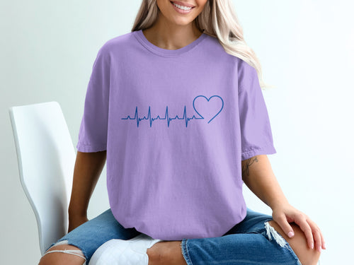 Purple t-shirt with a blue heartbeat and heart graphic.