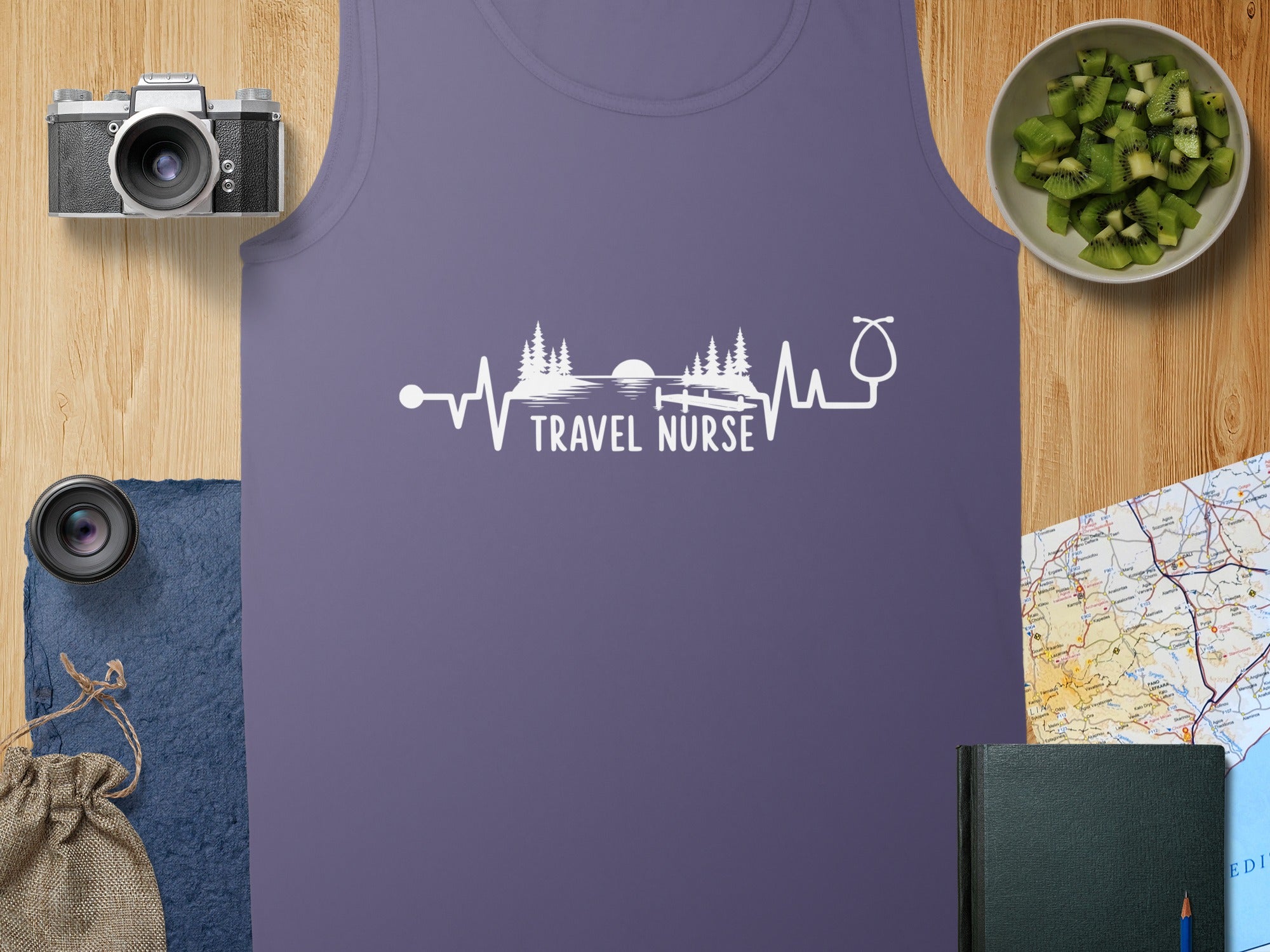 Purple tank top with "Travel Nurse" text and heartbeat, stethoscope, and trees graphic.