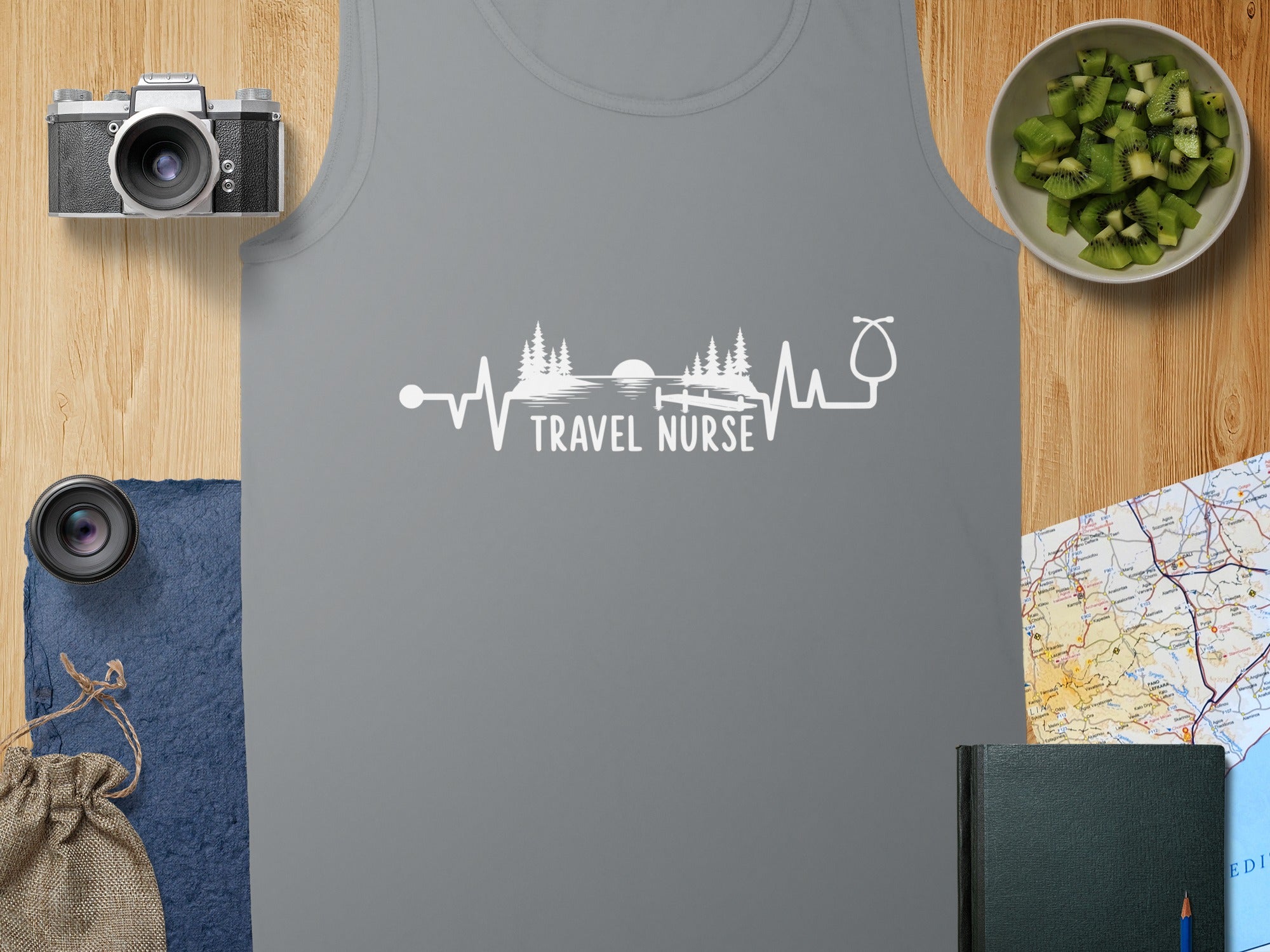 Gray tank top with "Travel Nurse" text featuring a heartbeat and stethoscope graphic.