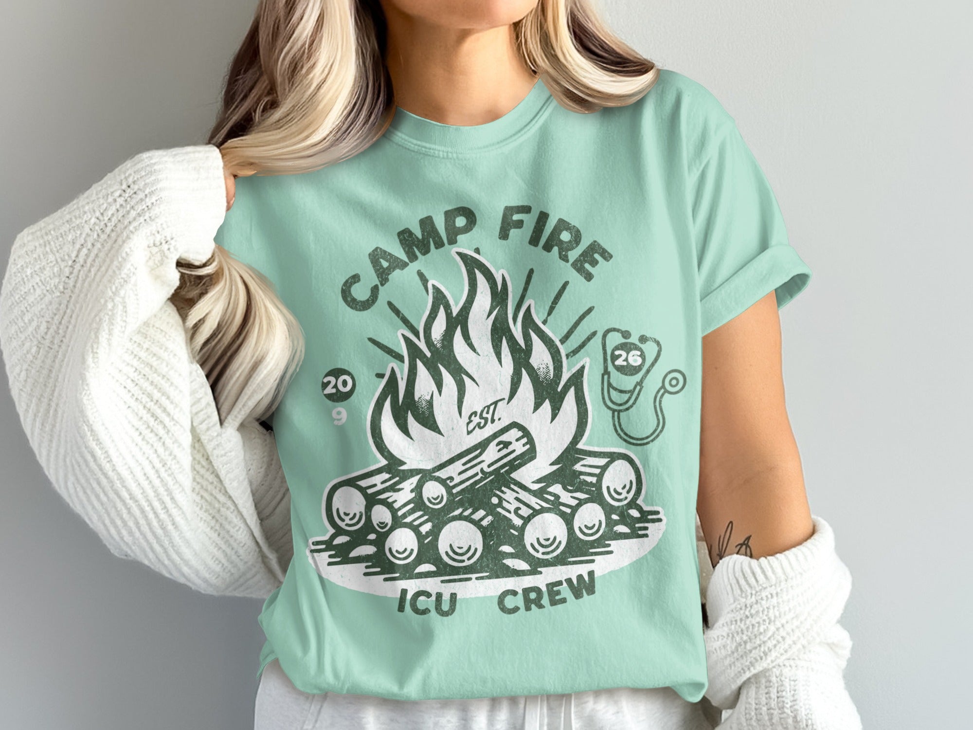 Mint green t-shirt with campfire and "ICU CREW" text.