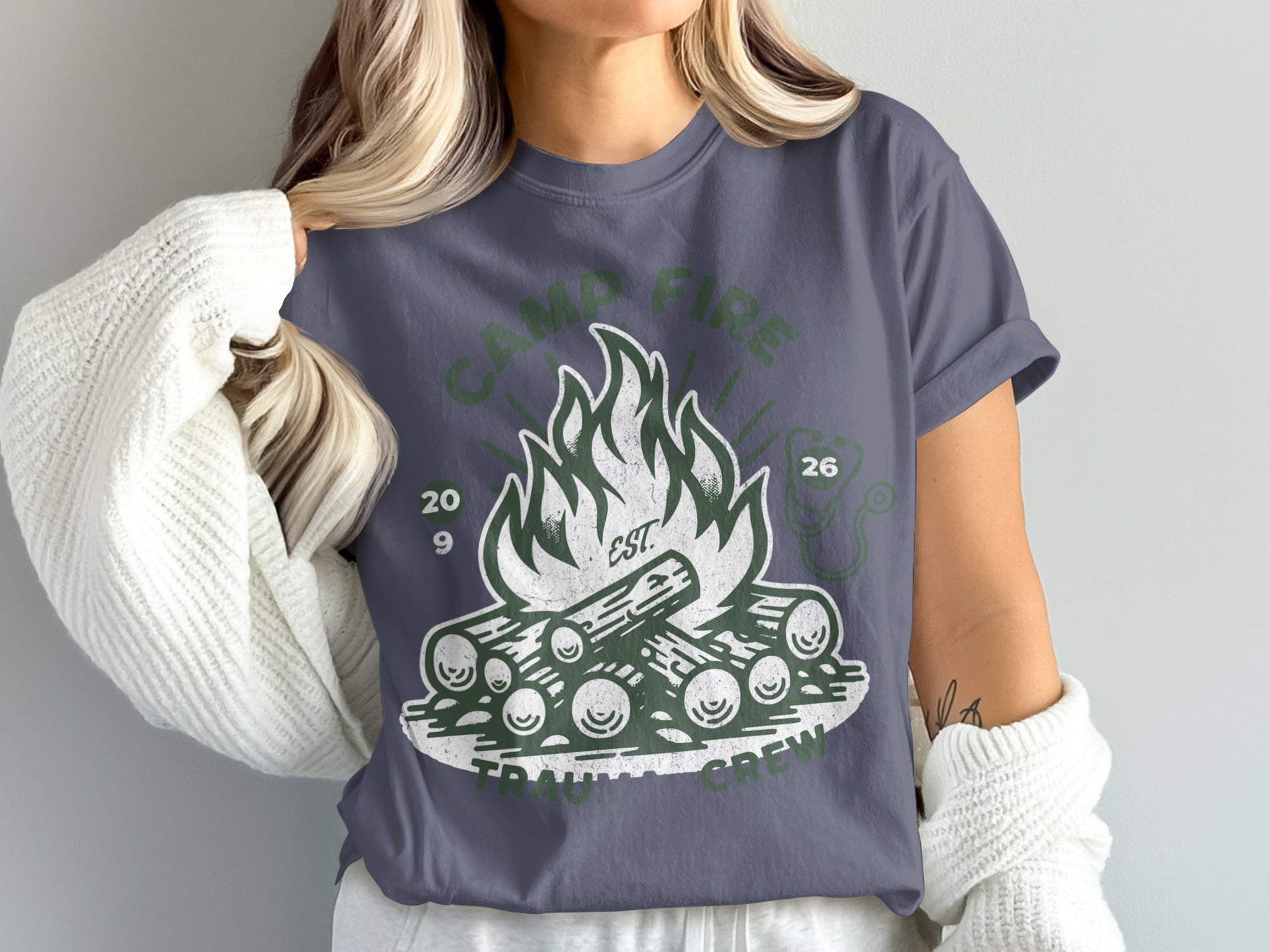 Camp fire graphic tee with "Trauma Crew" text and year 26.