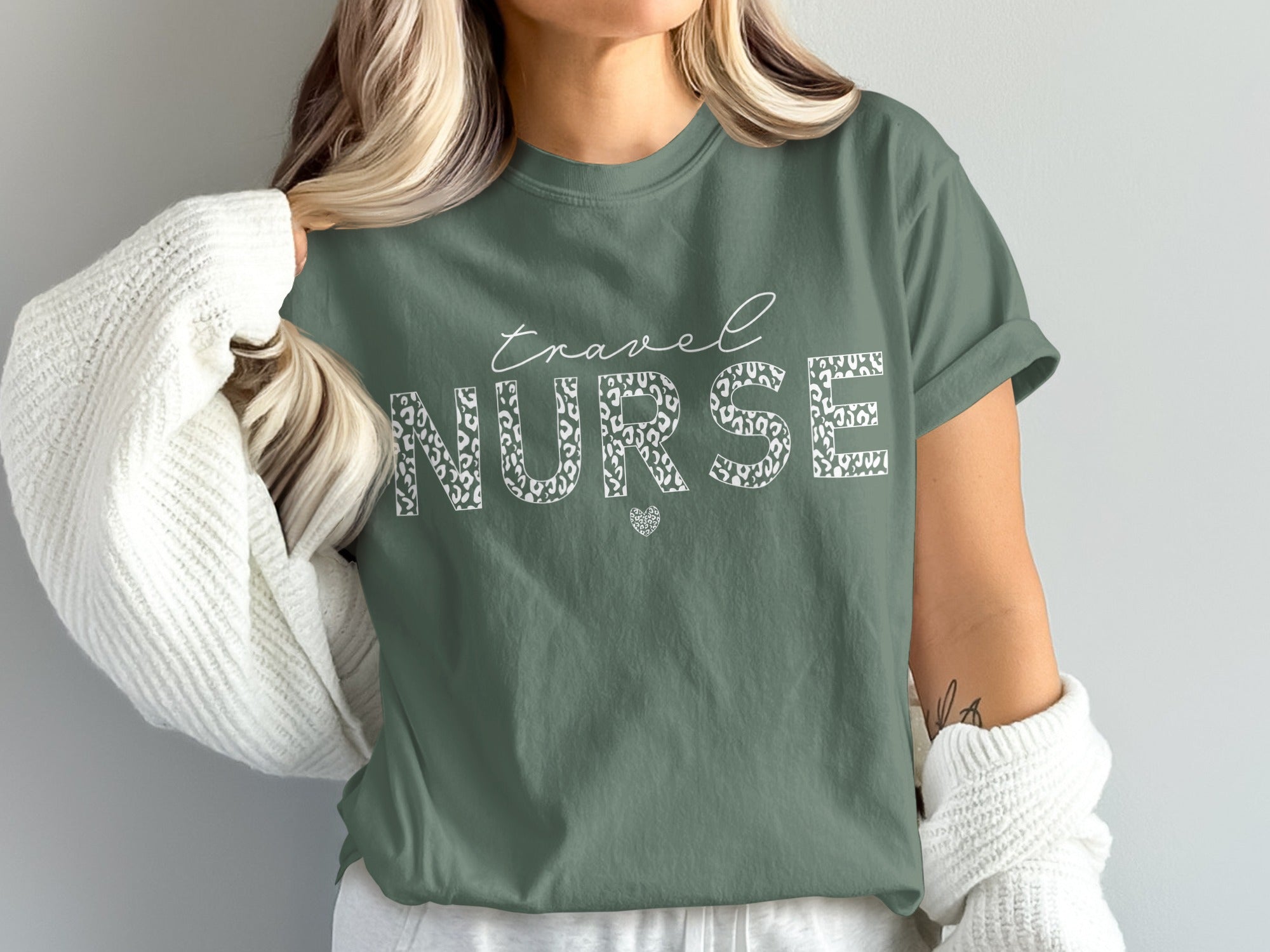 Green t-shirt with "travel NURSE" and leopard print text.