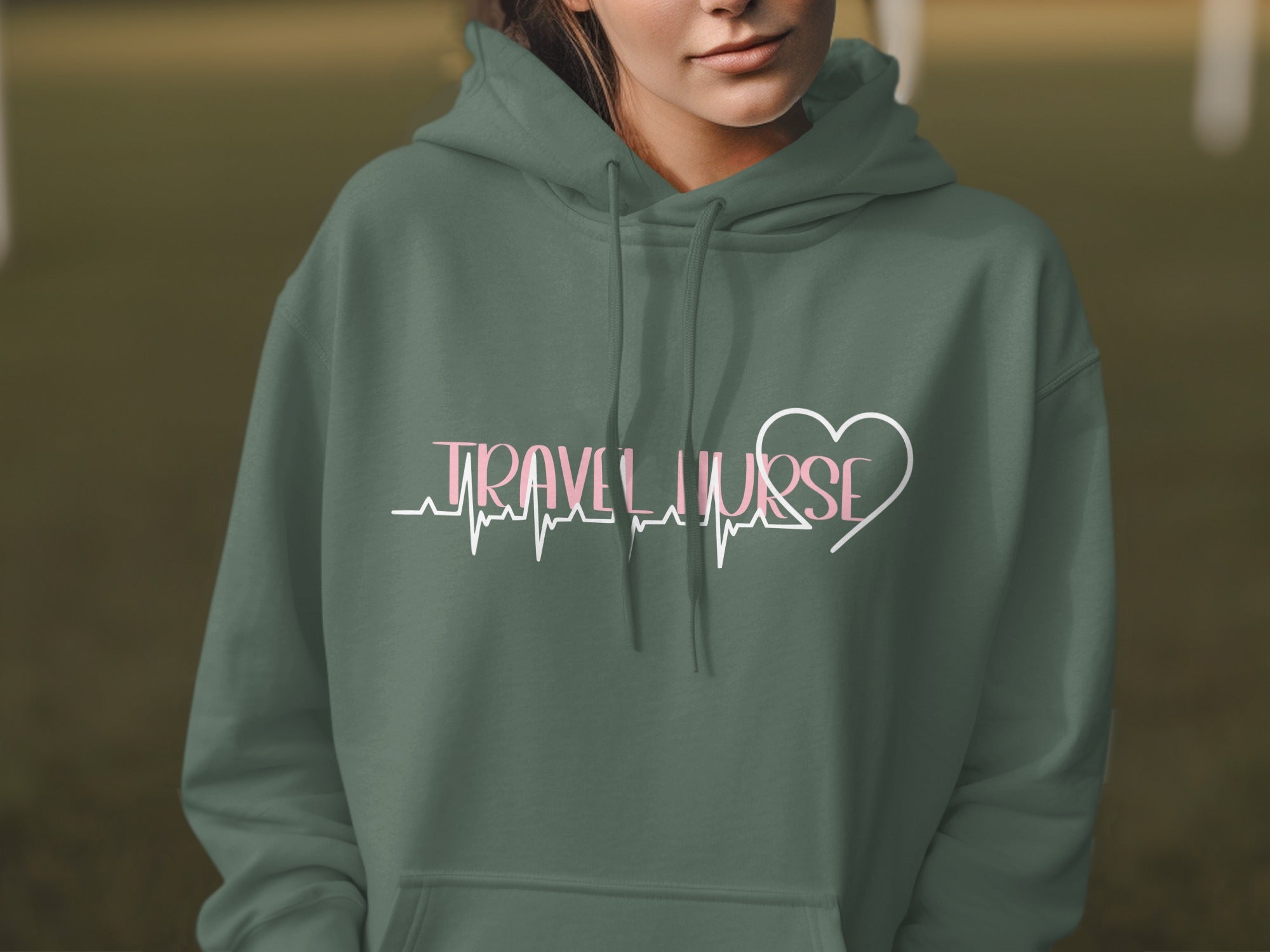 Green hoodie with "Travel Nurse" text and a heart heartbeat graphic.