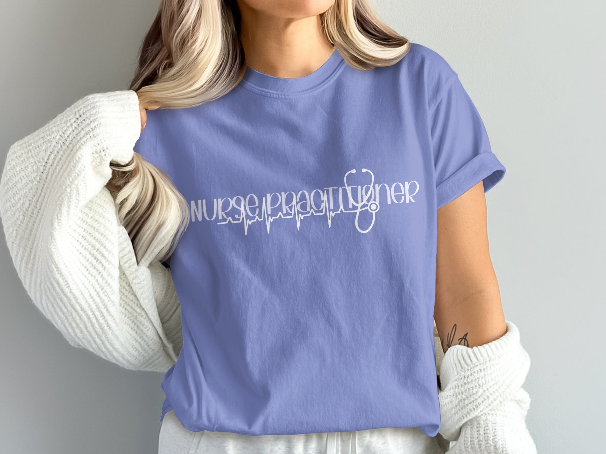 Lavender t-shirt with "Nurse Practitioner" and stethoscope graphic.