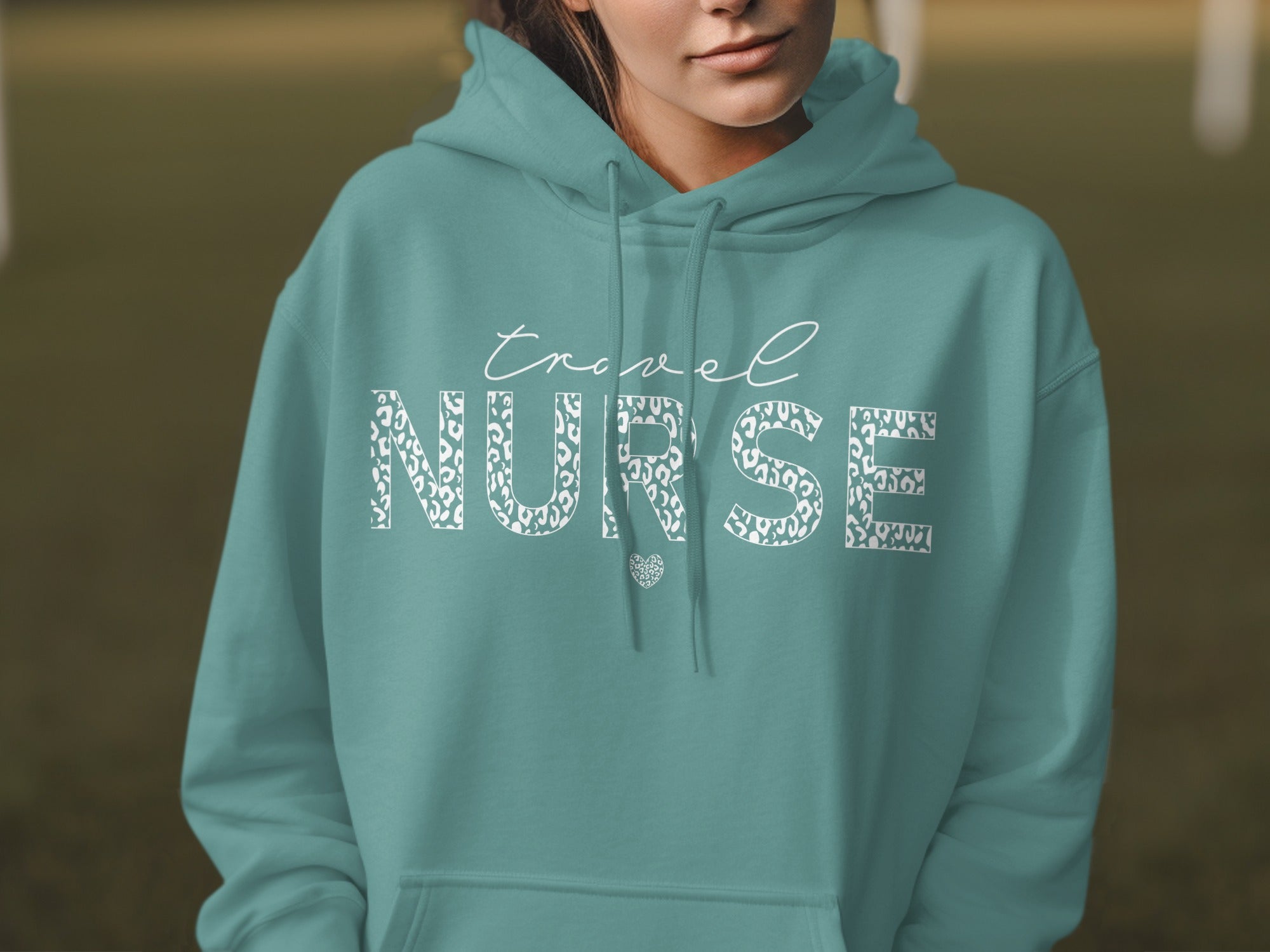 Teal hoodie with "travel NURSE" text in leopard print.
