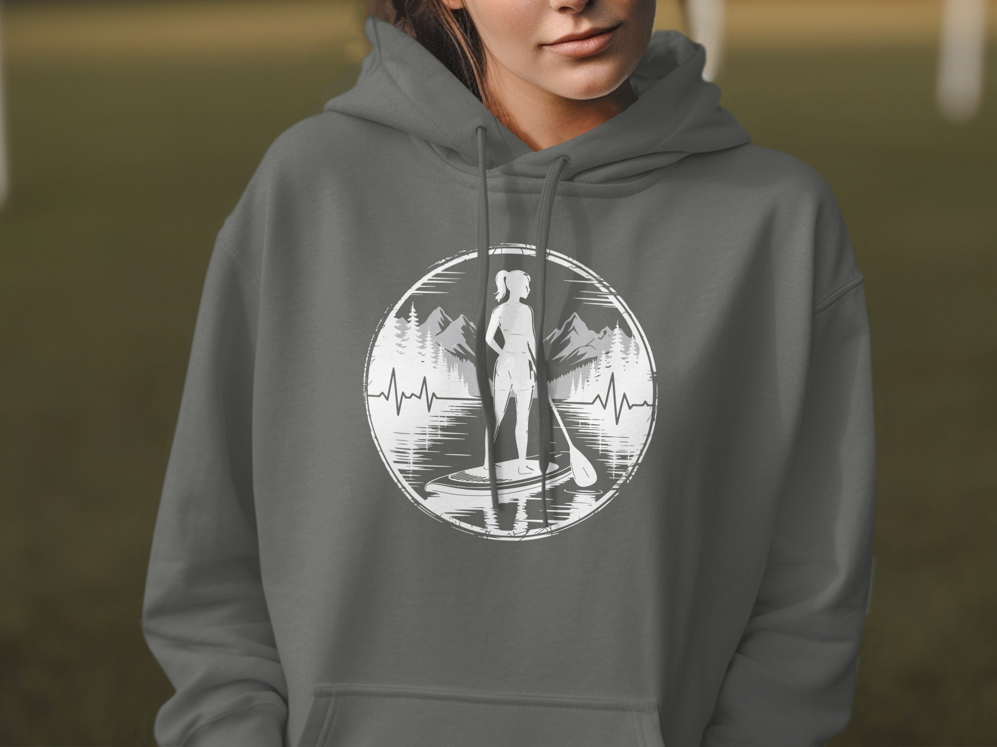 Gray hoodie with a circular graphic of a paddleboarder, mountains, and a heartbeat line.