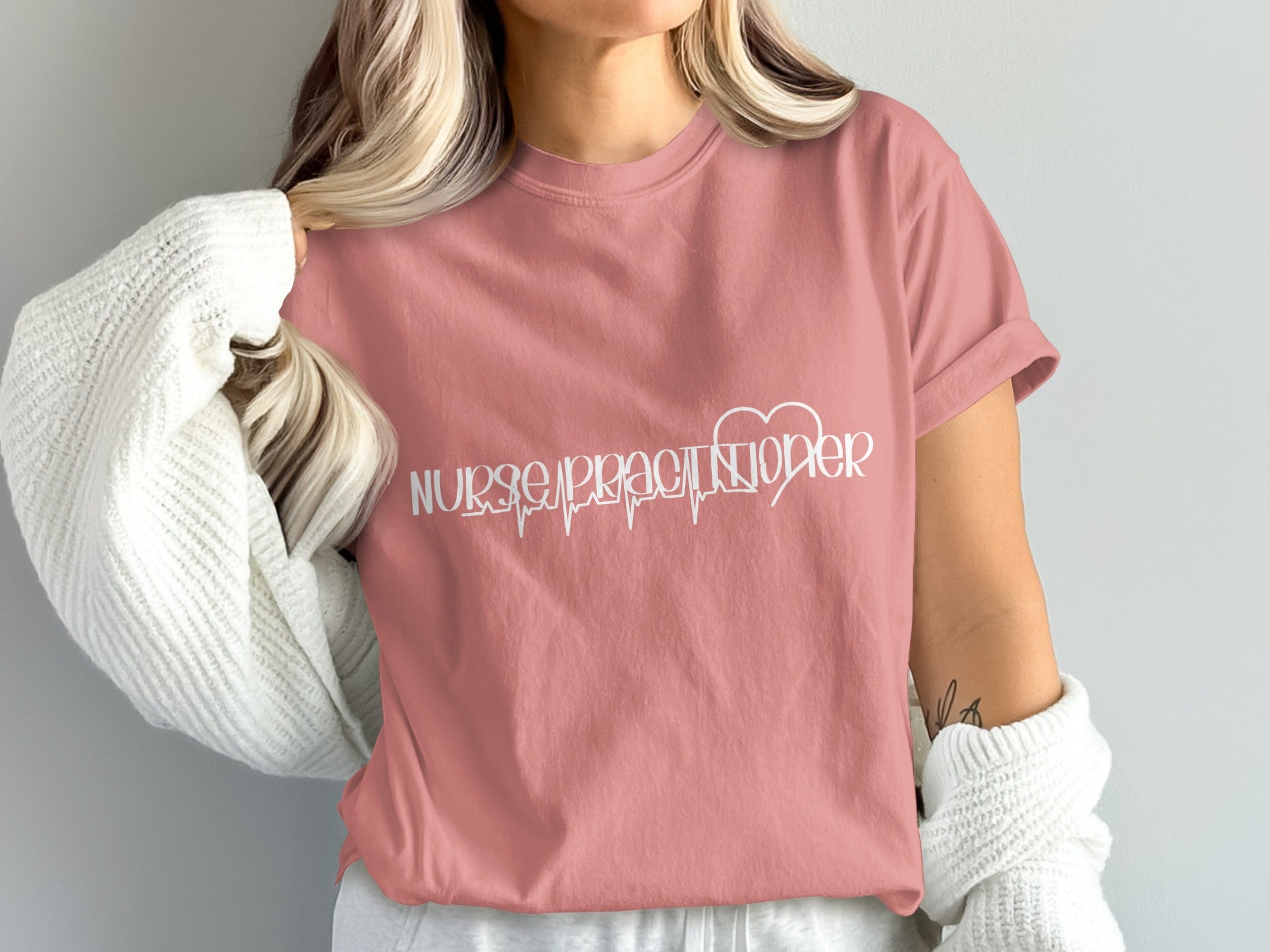 Nurse practitioner t-shirt with a heartbeat EKG line.